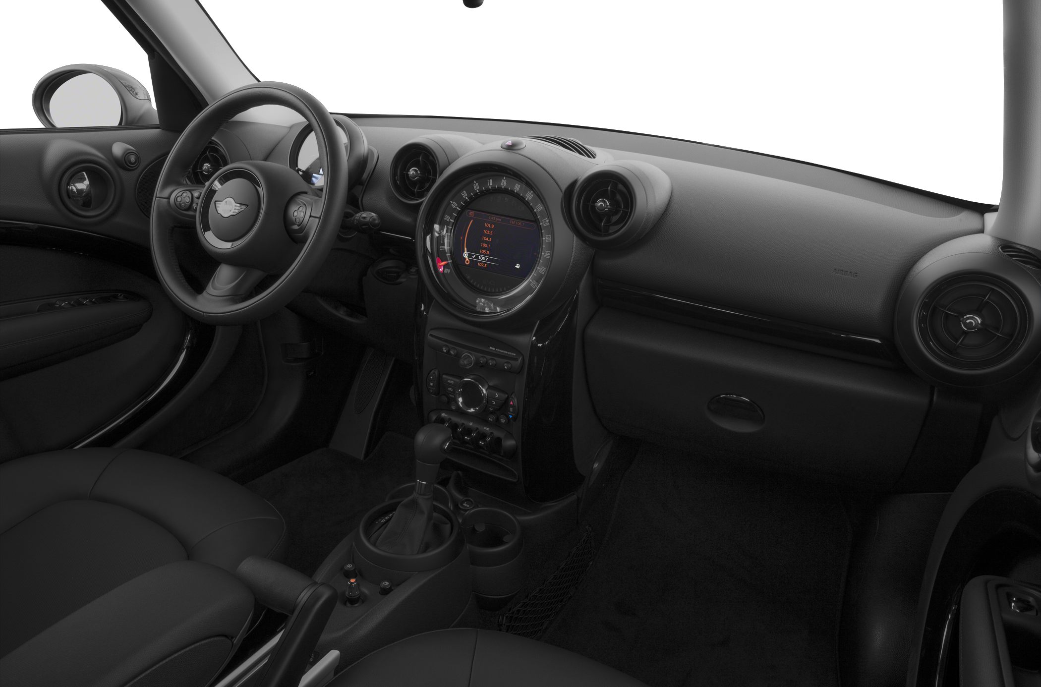 Modern dashboard and center console with circular air vents and infotainment display