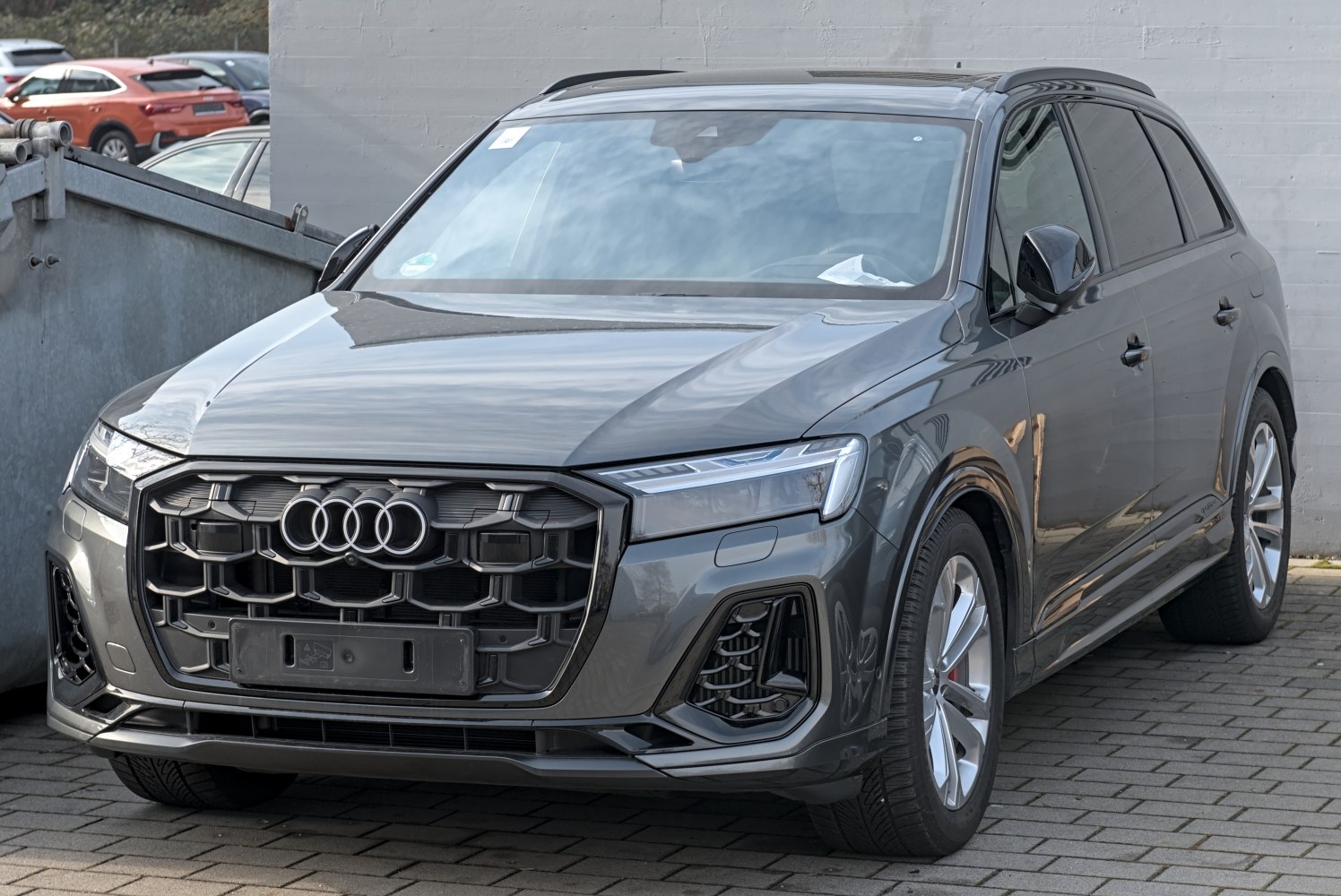 Front grille and LED headlights of a modern luxury SUV.