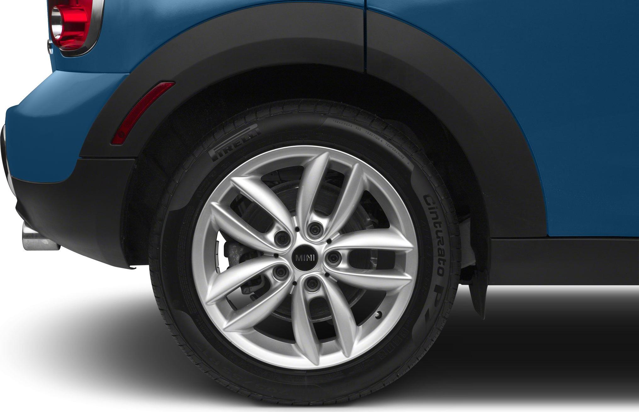 Close-up of alloy wheel and tire with brake disc and wheel arch