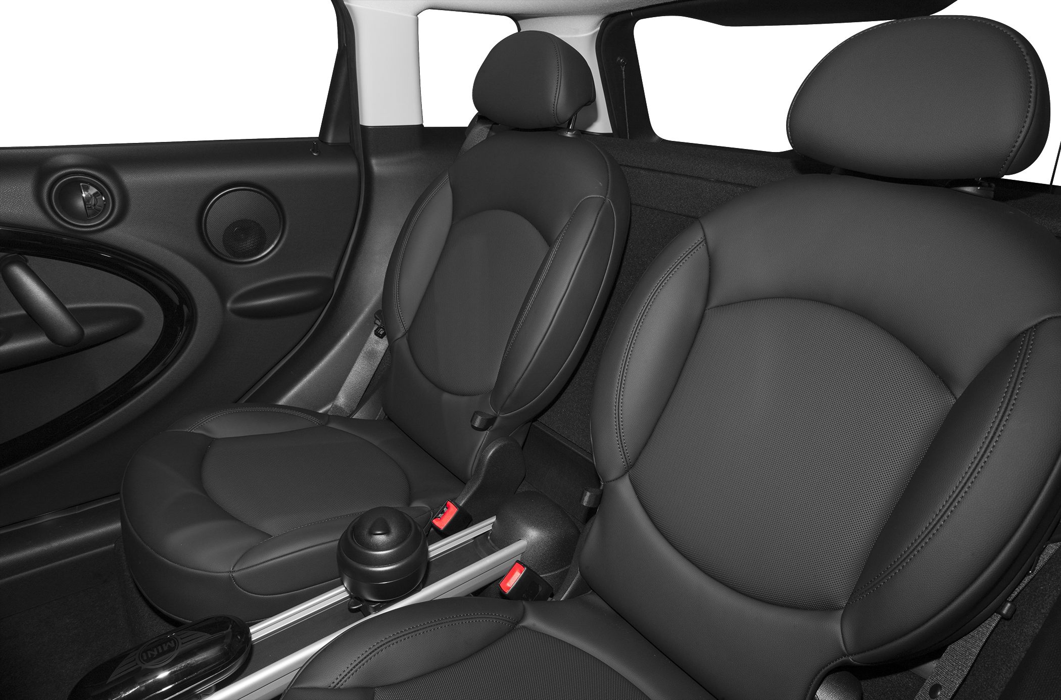 Close-up of front leather seats and door panel with speaker and armrest