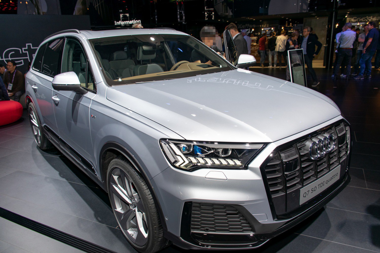 LED headlights and aggressive front grille of a silver SUV
