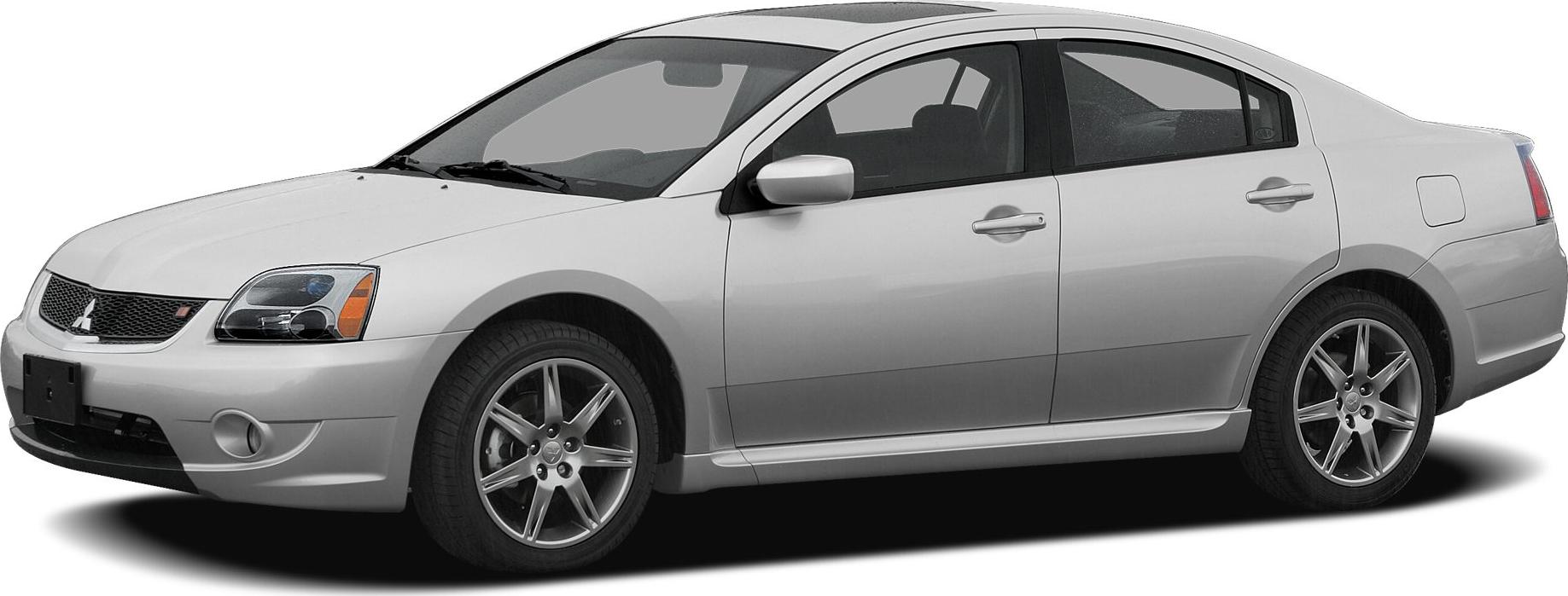 Silver sedan front side view with prominent headlights and alloy wheels