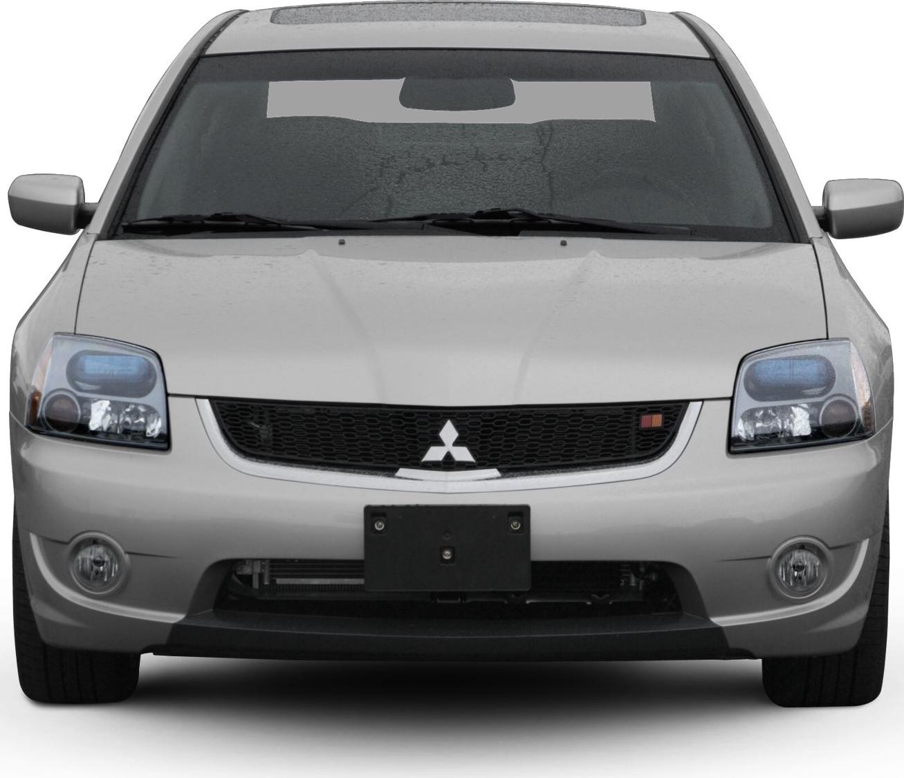 Front view with headlights, grille, and fog lights