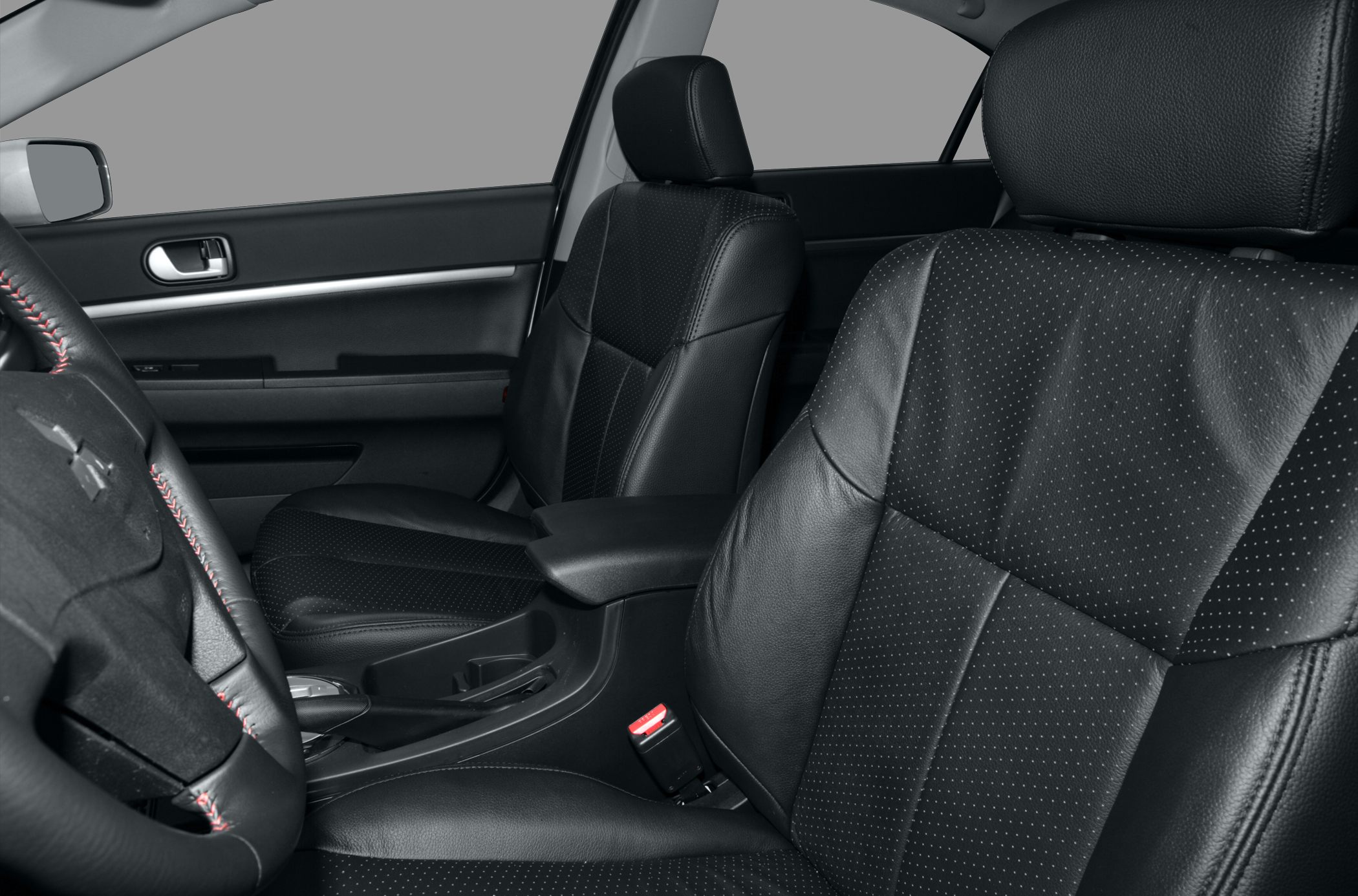 Black leather perforated seats with steering wheel and center console interior
