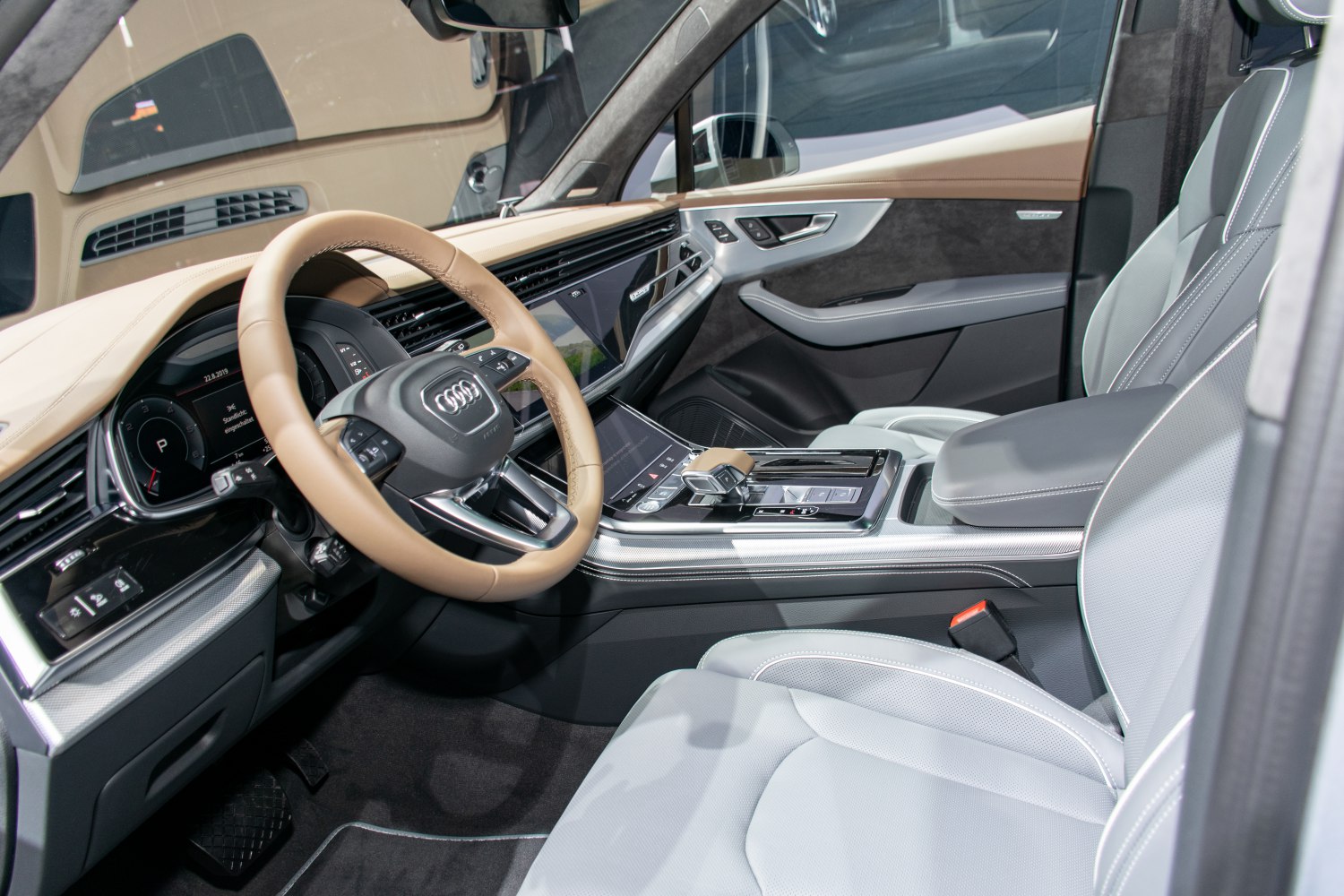 Modern digital dashboard and leather steering wheel in premium car interior