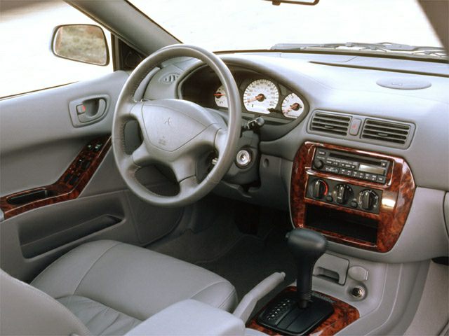 Dashboard, steering wheel, and center console with wood trim