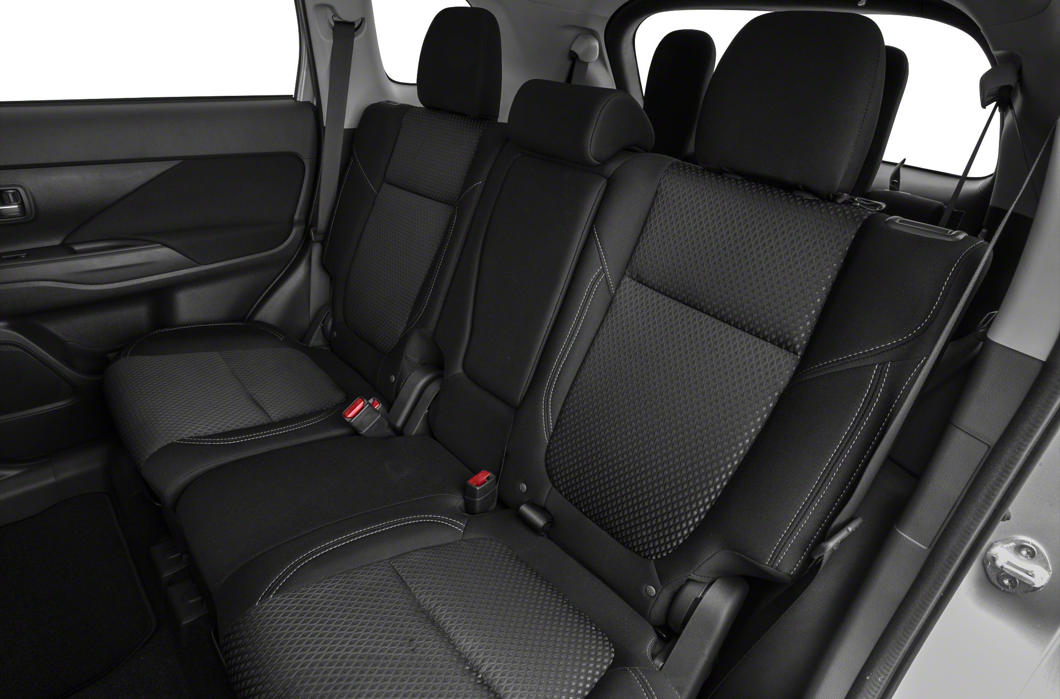 Rear seating interior with black upholstery and three headrests.