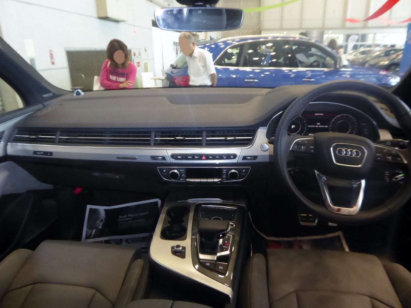 Modern luxury car interior with dashboard and steering wheel