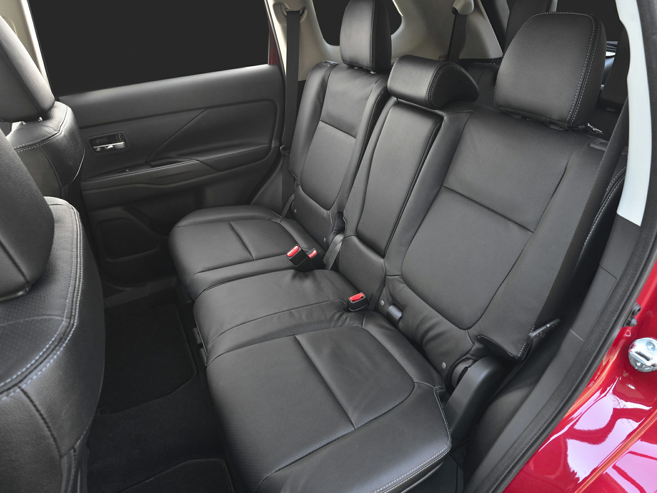 Black leather rear seats with stitching in mid-size SUV