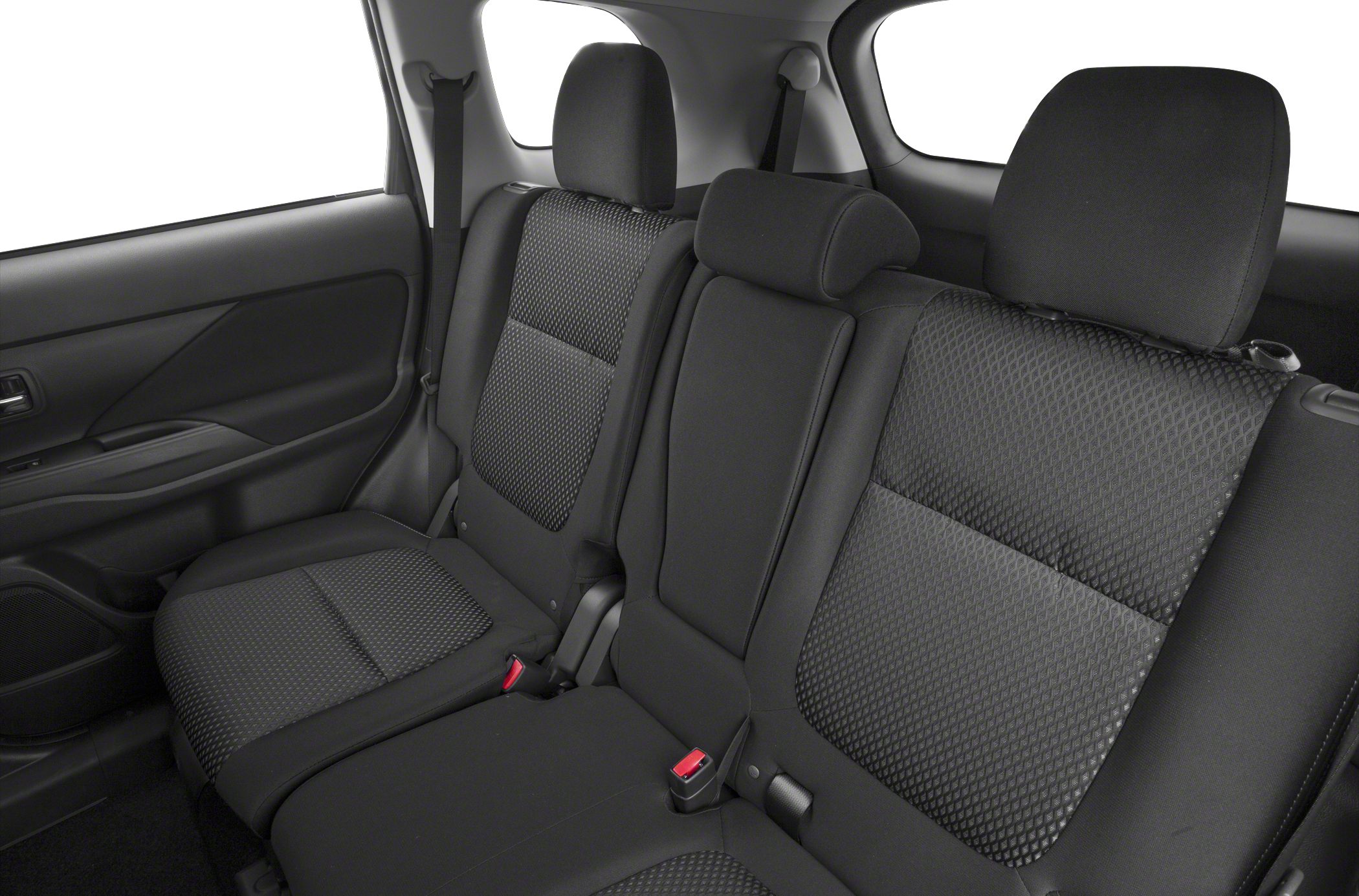 Rear seat fabric upholstery with three headrests and seat belts.