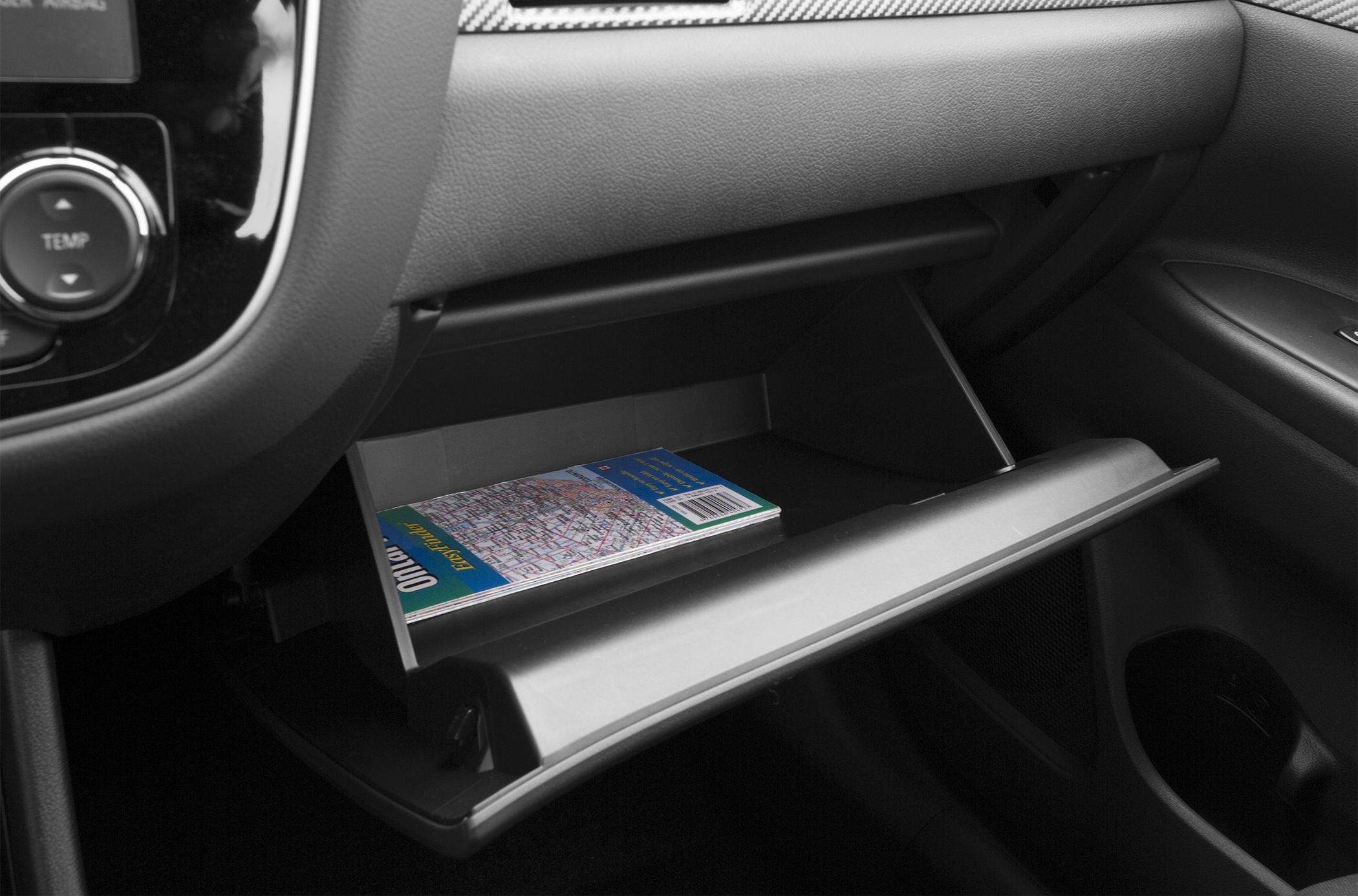 Open glove compartment with map inside