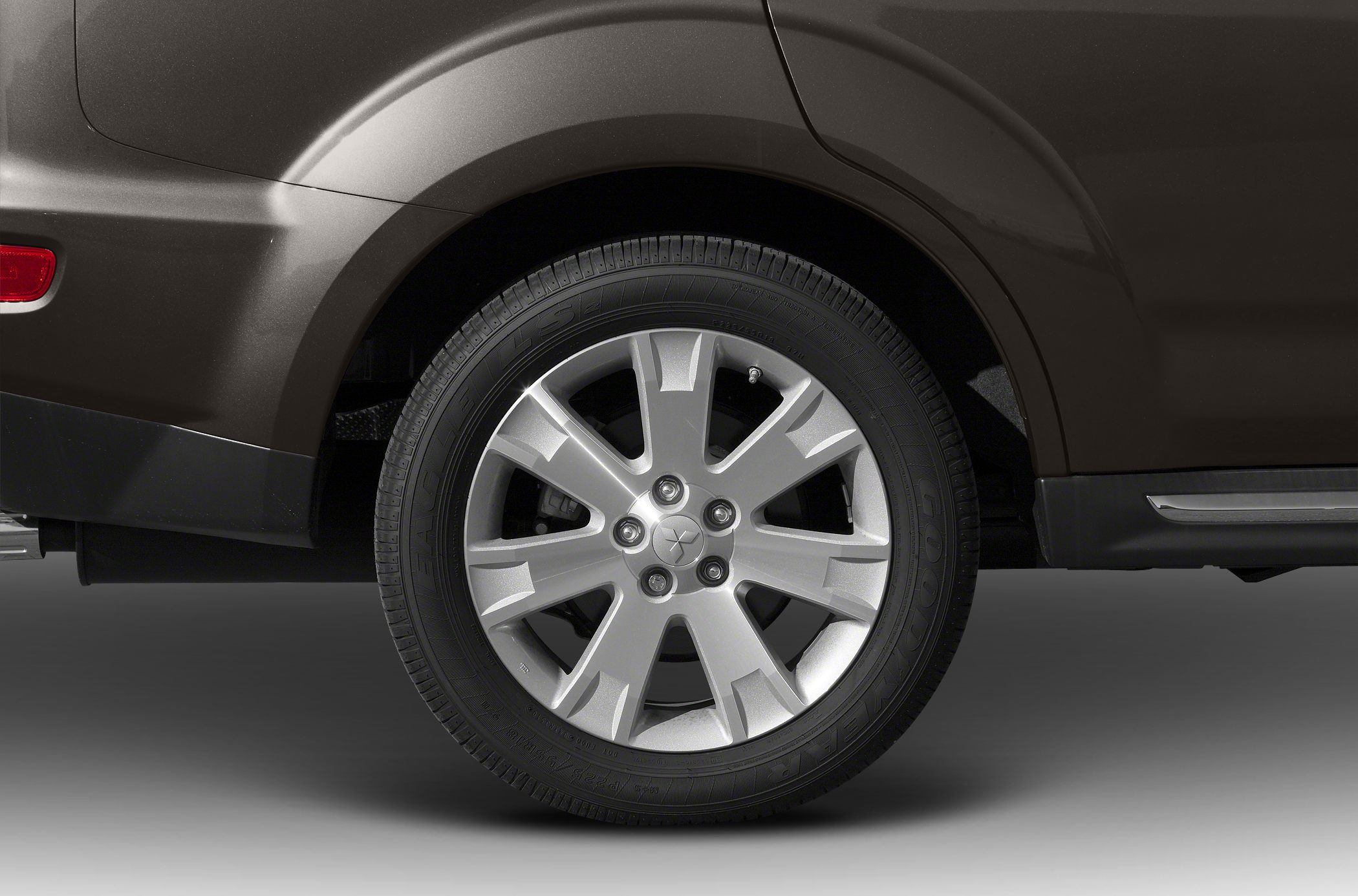 Close-up of alloy wheel and tire on rear side of the vehicle