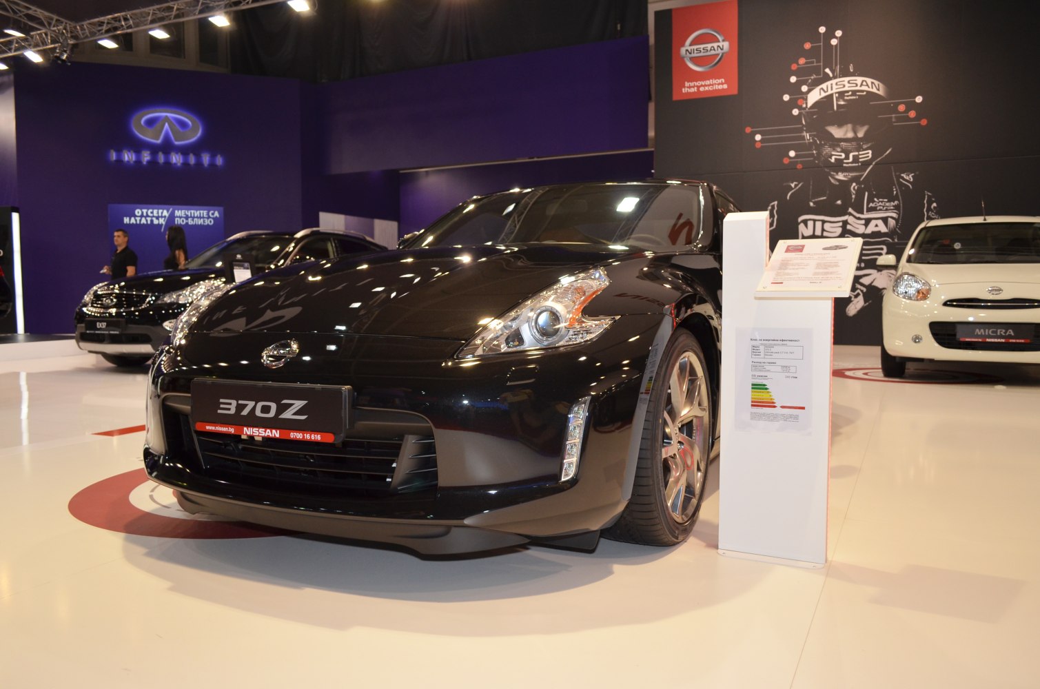 Front view of a sleek sports coupe with distinctive headlights and alloy wheels.