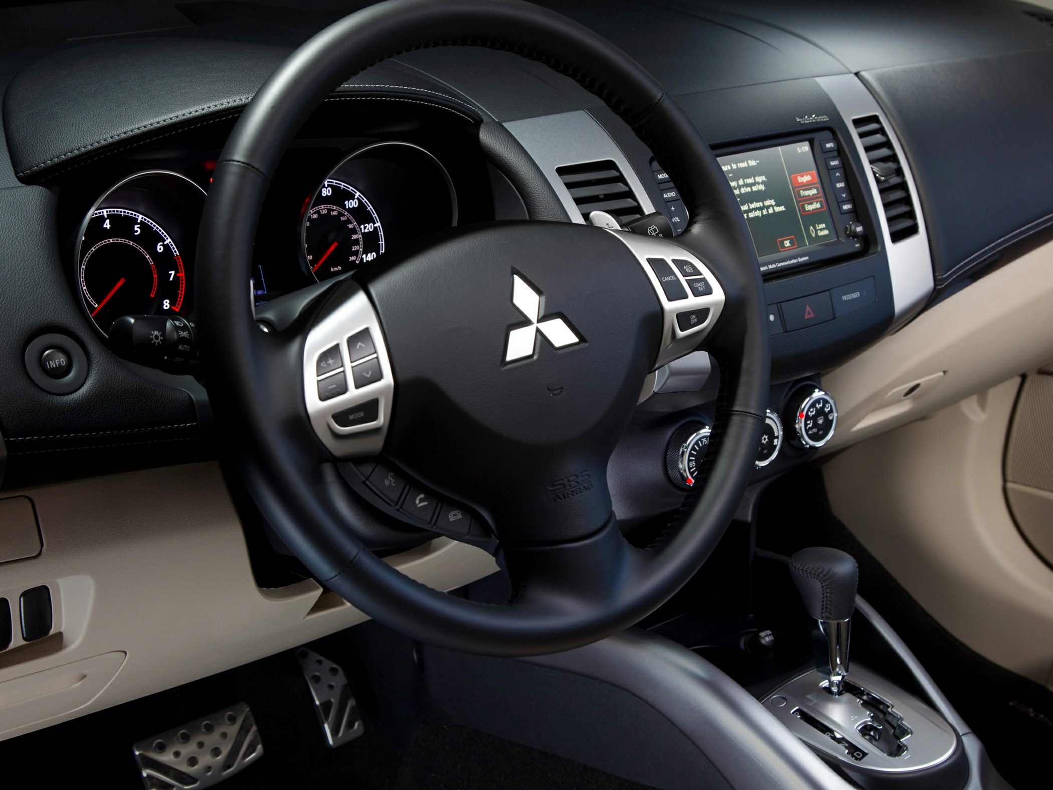 Dashboard and steering wheel with digital displays and controls