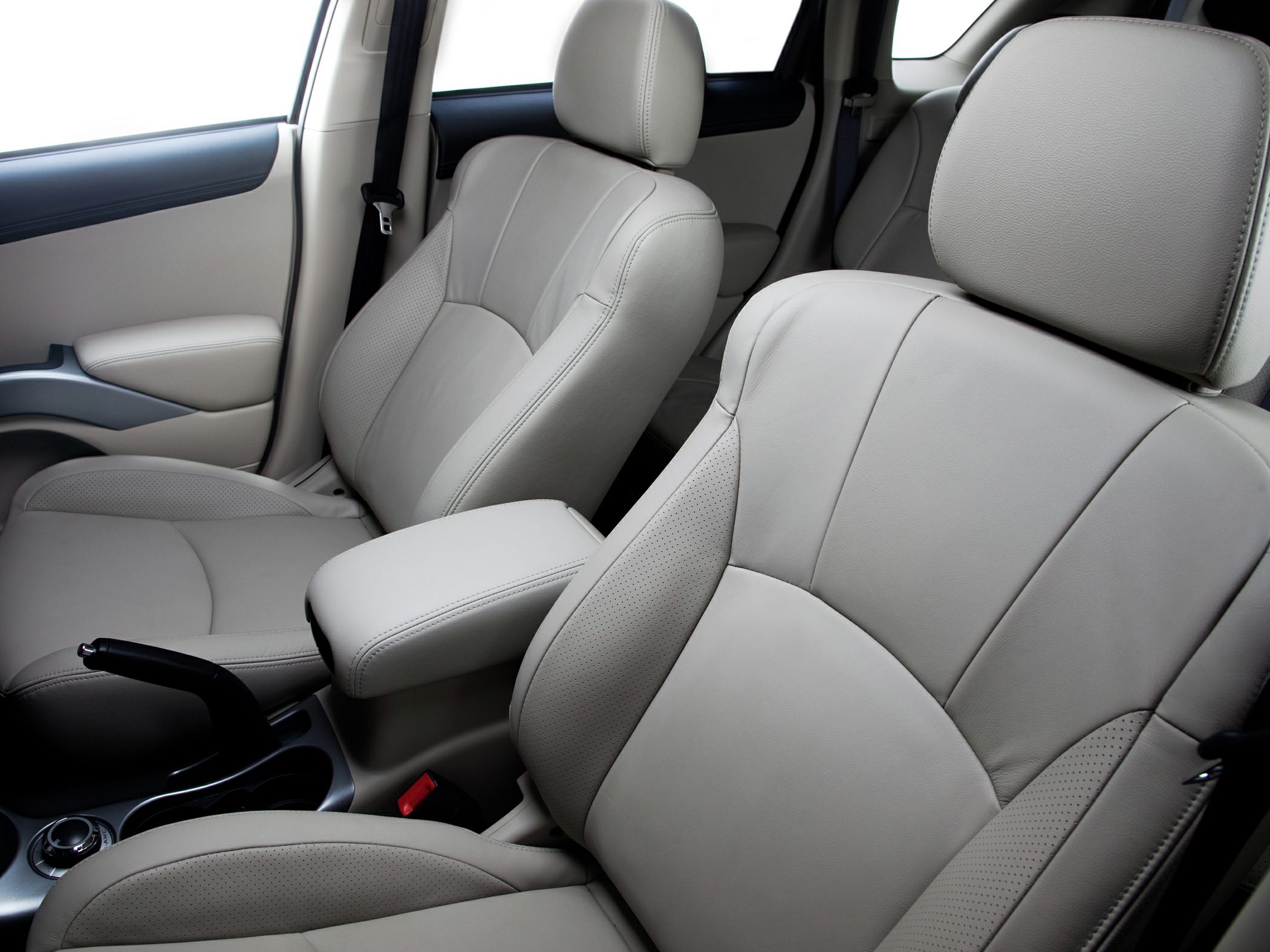 Beige leather front seats with armrest in compact SUV interior
