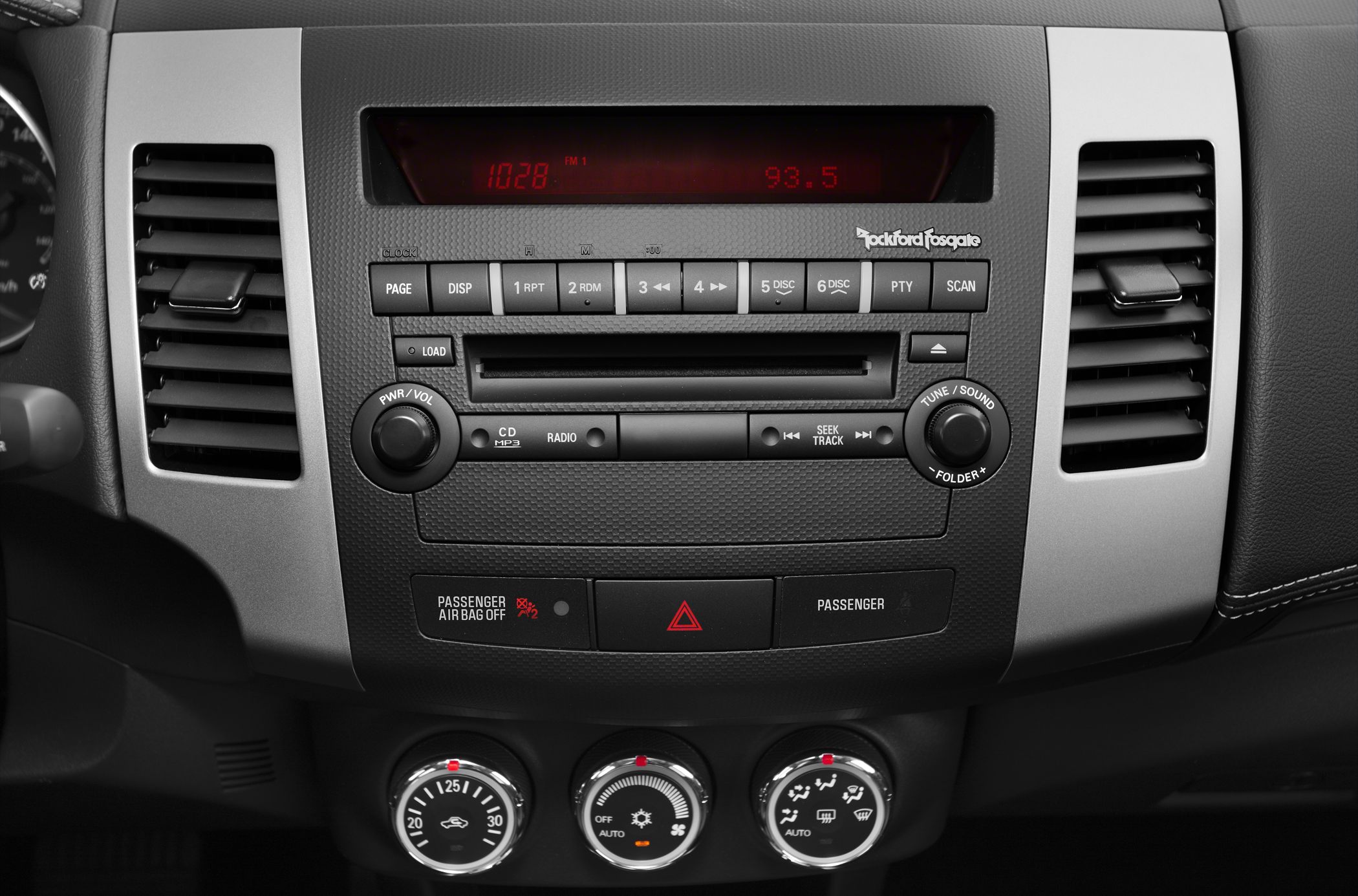 Radio and climate control panel with CD player and air conditioning knobs