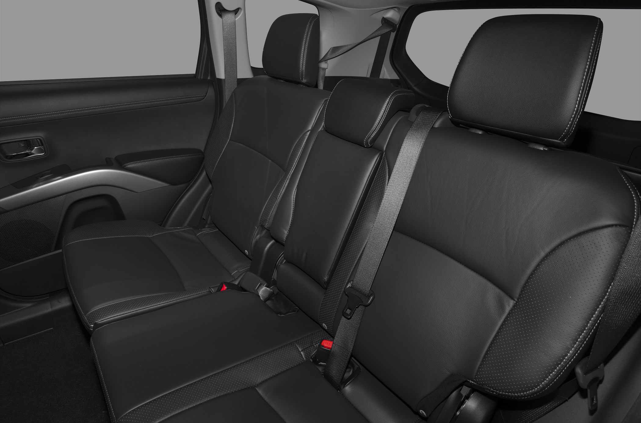 Black leather rear seat with integrated headrests and seatbelt