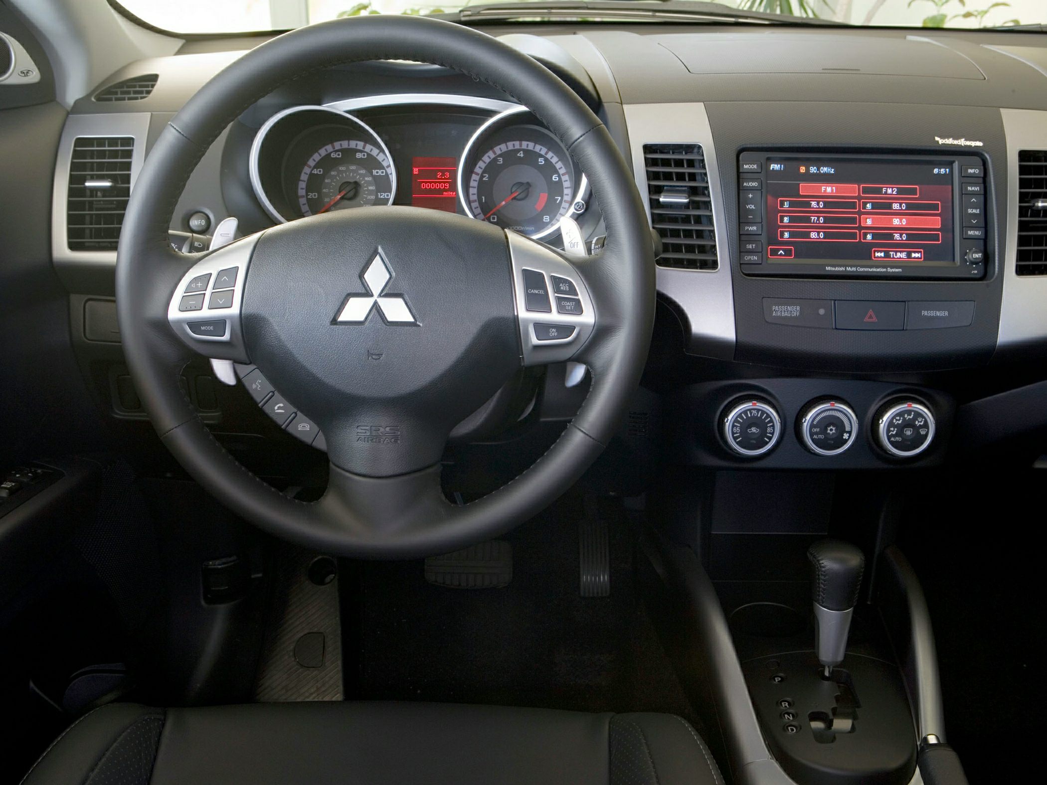 Steering wheel controls, dashboard display, and center console layout