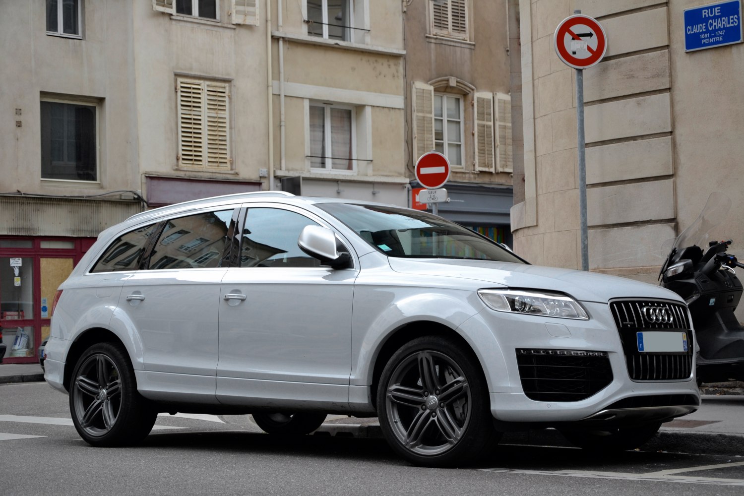 Silver SUV front-side view with alloy wheels and distinctive grille