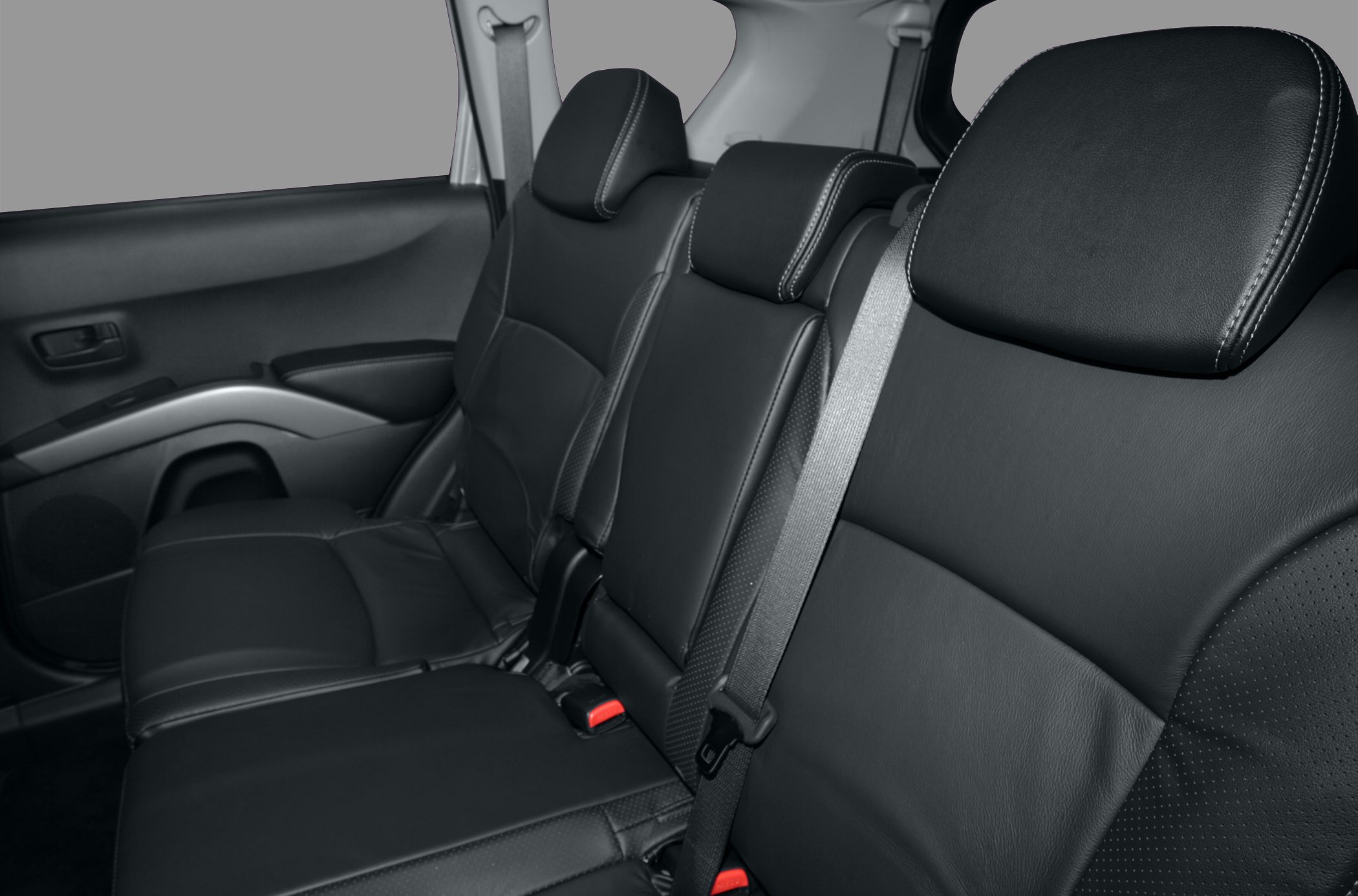 Black leather rear seats with seatbelts in car interior
