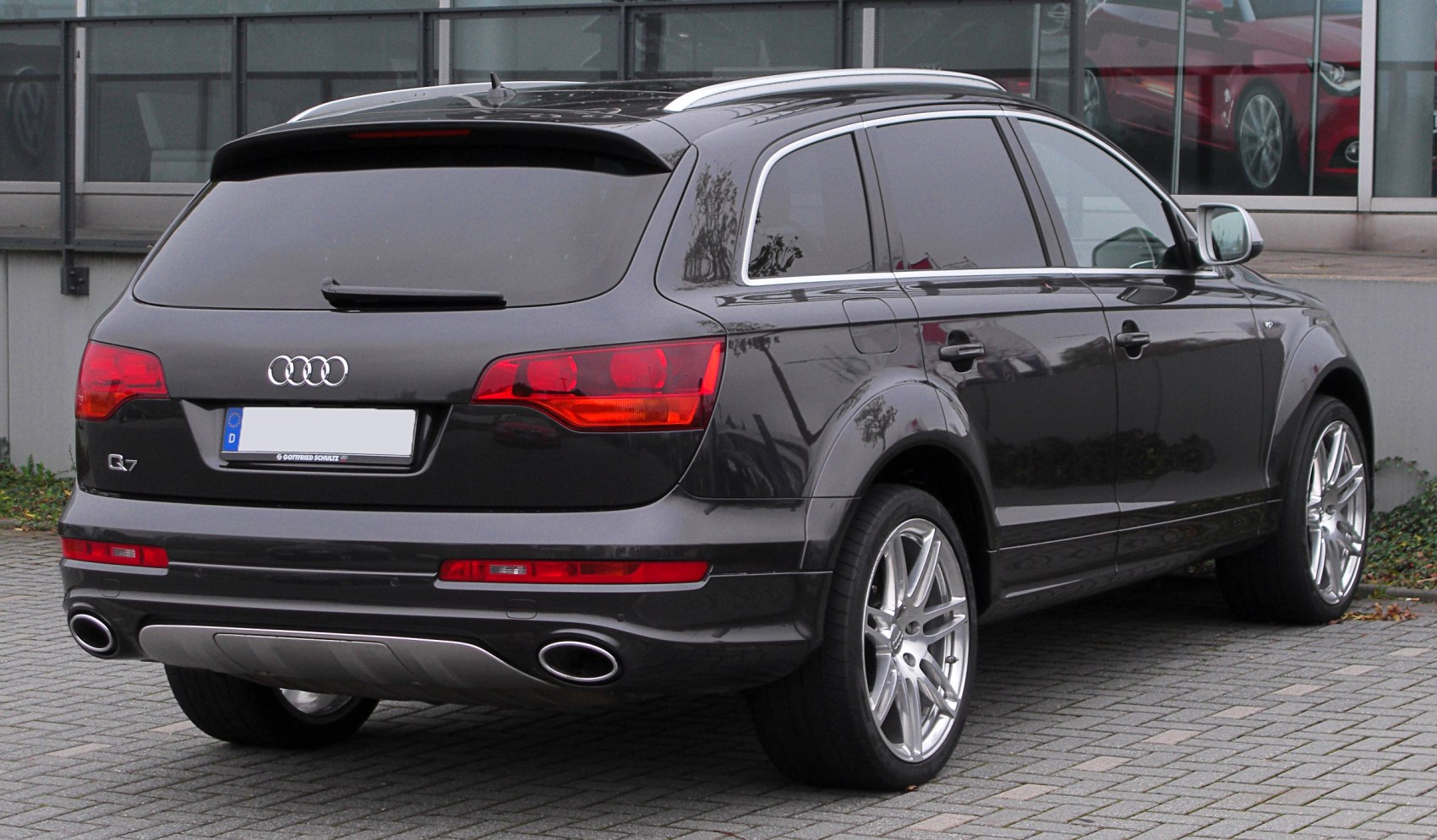 Rear view with red tail lights and dual oval exhaust pipes