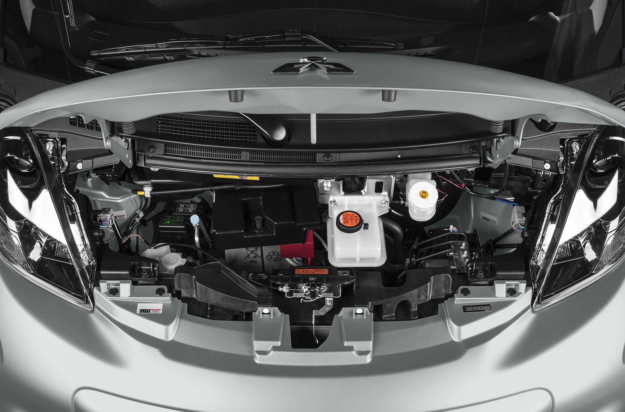 Open engine bay with visible fluid reservoirs and battery