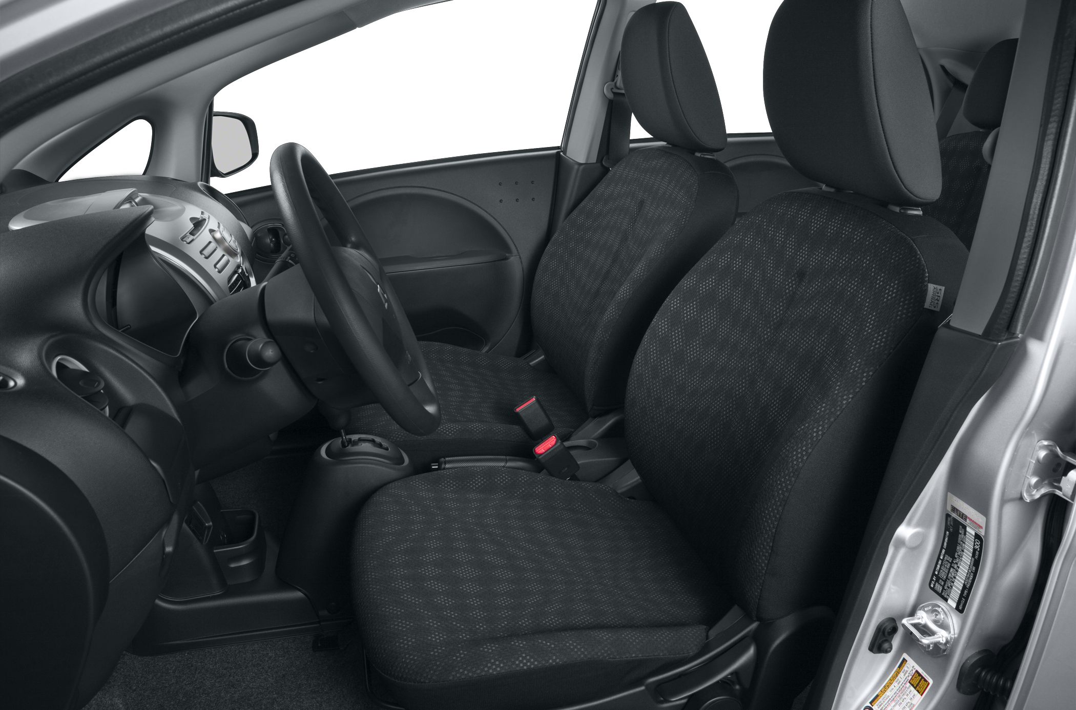 Front bucket seats and dashboard with steering wheel in compact car interior