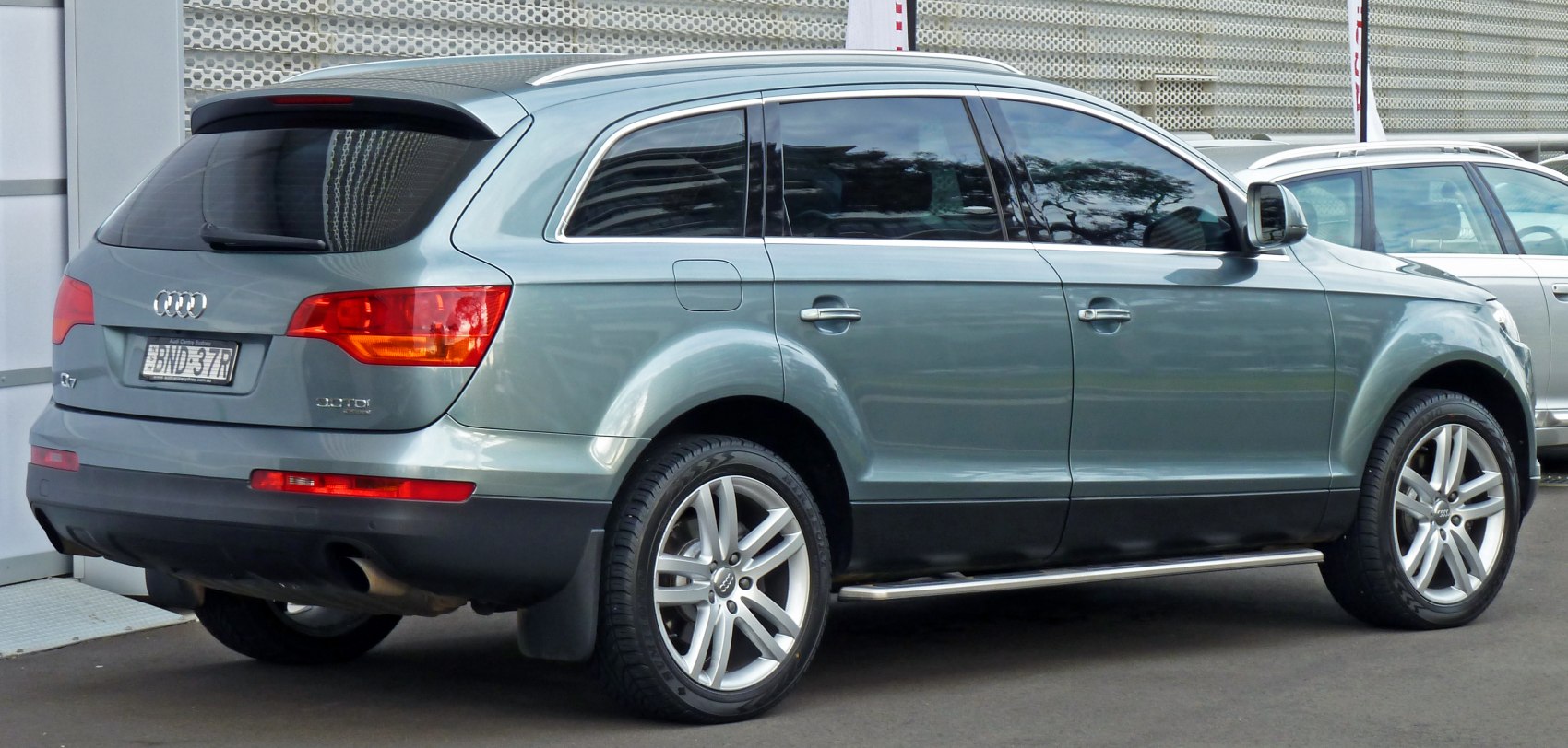 Side and rear view of SUV with alloy wheels and running boards