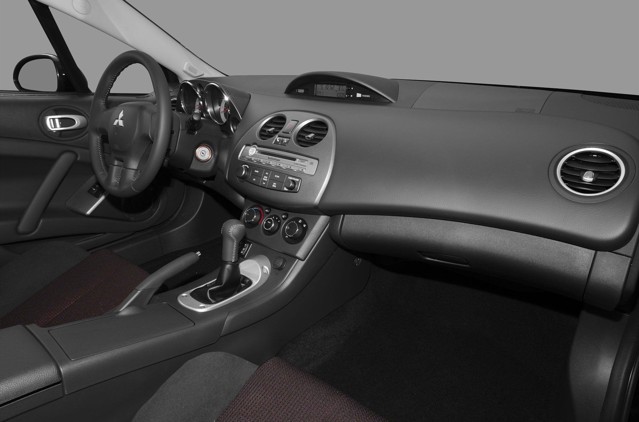 Dashboard layout and steering wheel with center console and controls