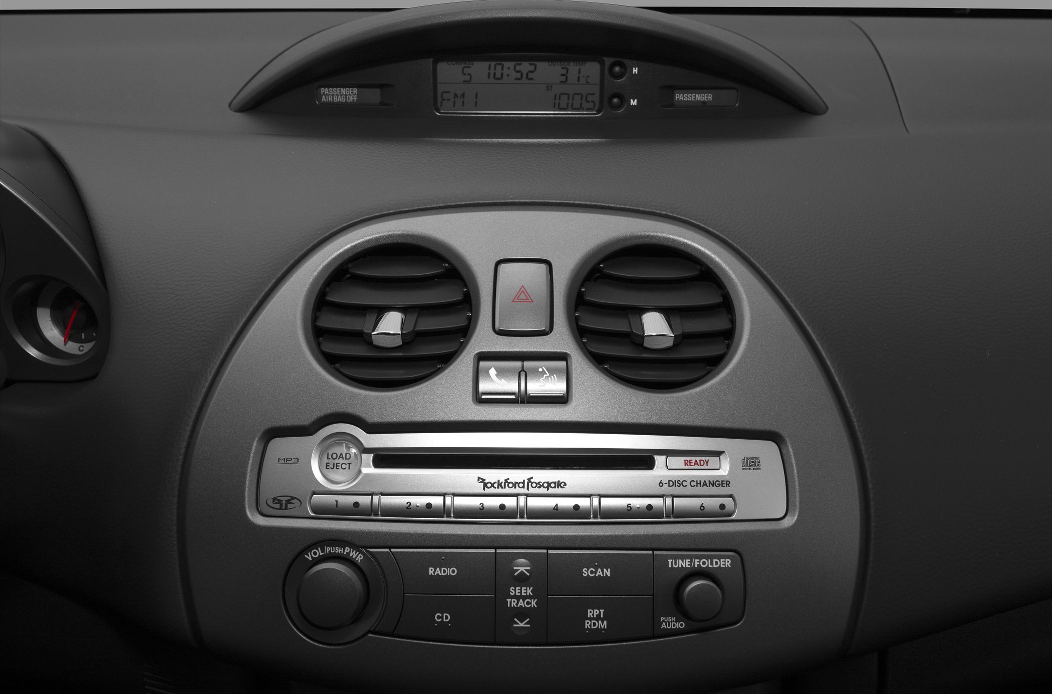 Close-up of car dashboard with audio system and air vents