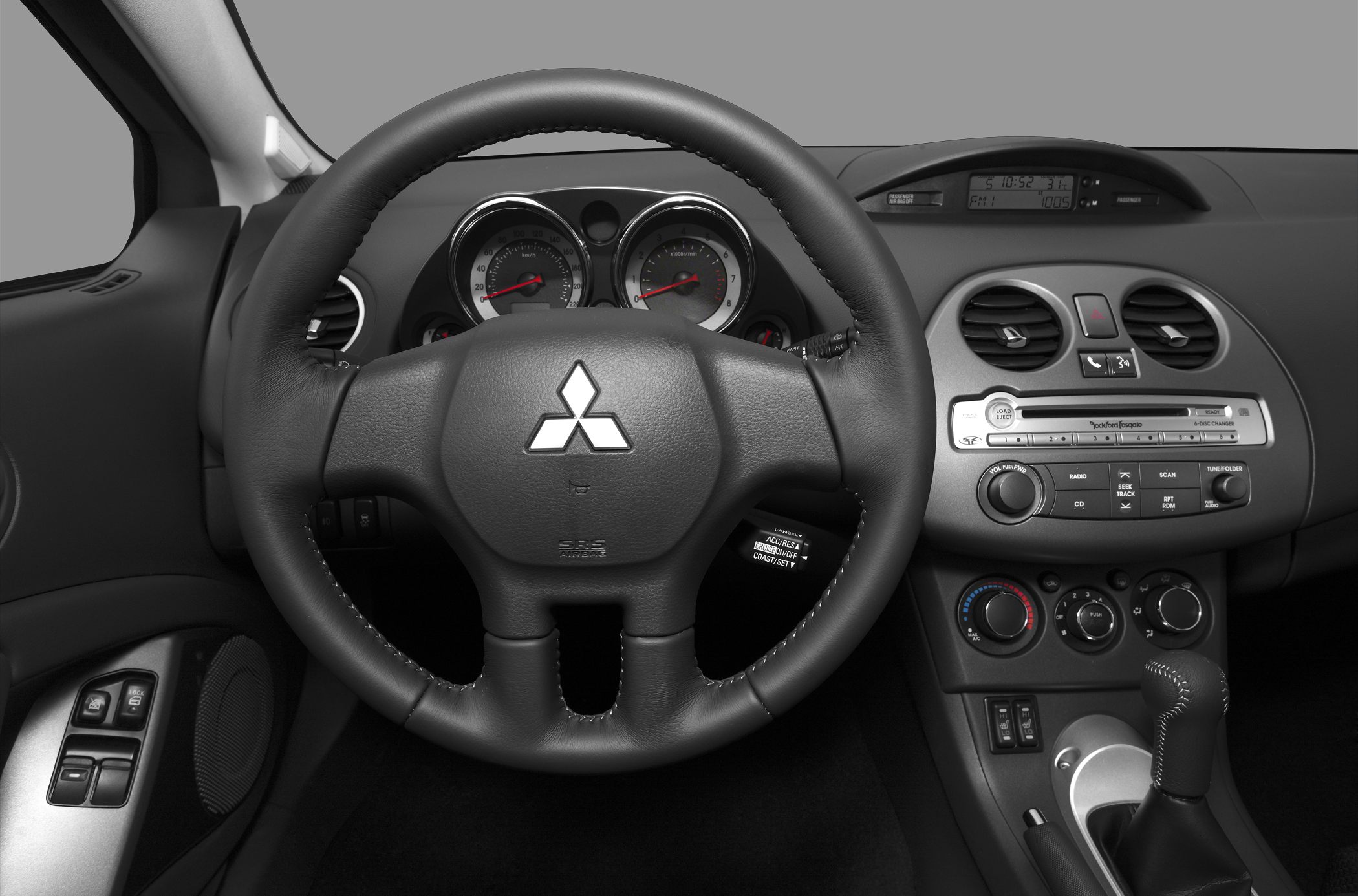 Steering wheel and dashboard with center console and controls
