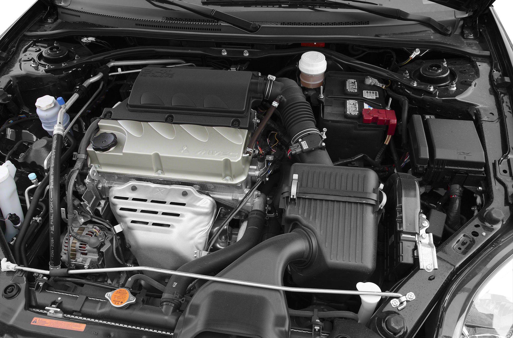 MIVEC engine and engine bay layout with intake and battery components