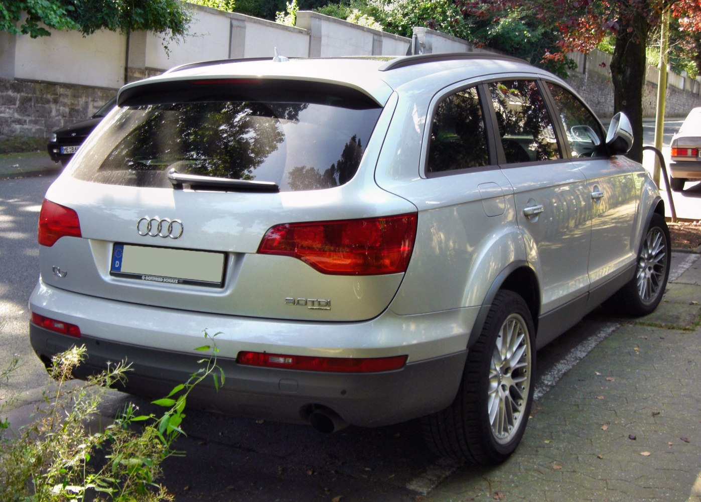 Rear view of SUV with distinctive tail lights and rear wiper