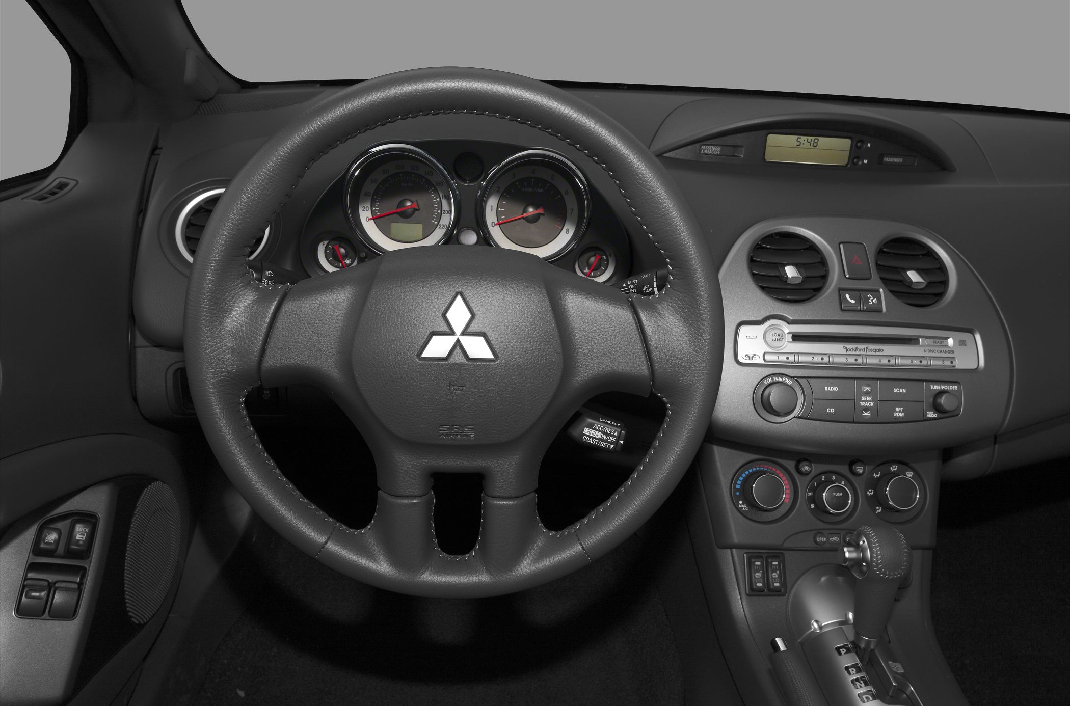 Dashboard, steering wheel, and center console with controls