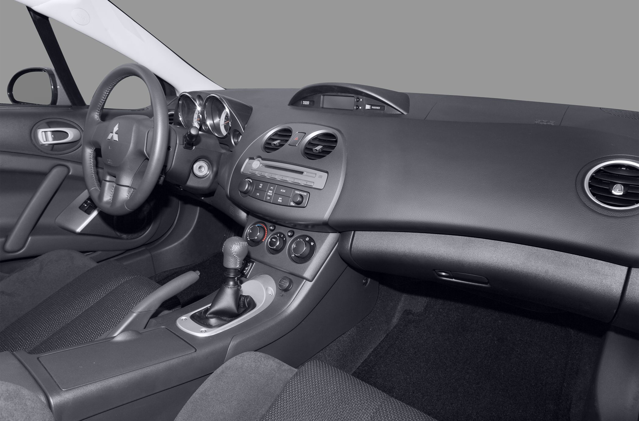 Car interior with manual gear shift and dashboard controls