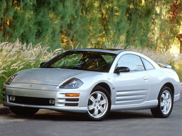 Silver sports coupe front angle with aerodynamic styling and alloy wheels