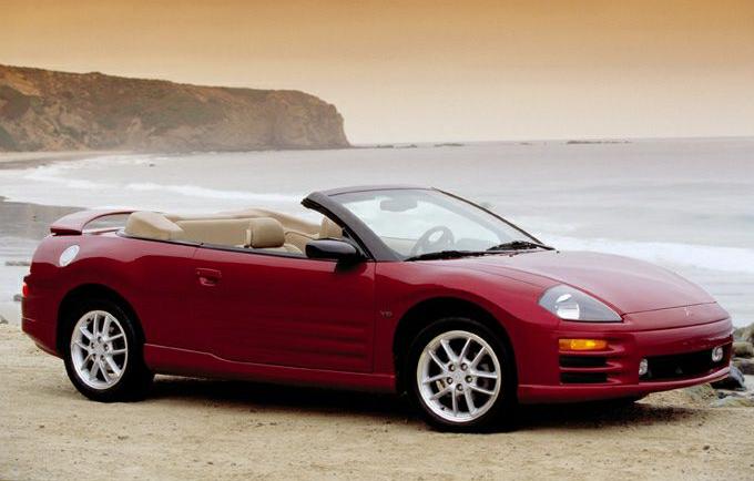 Red convertible with beige interior and sporty design