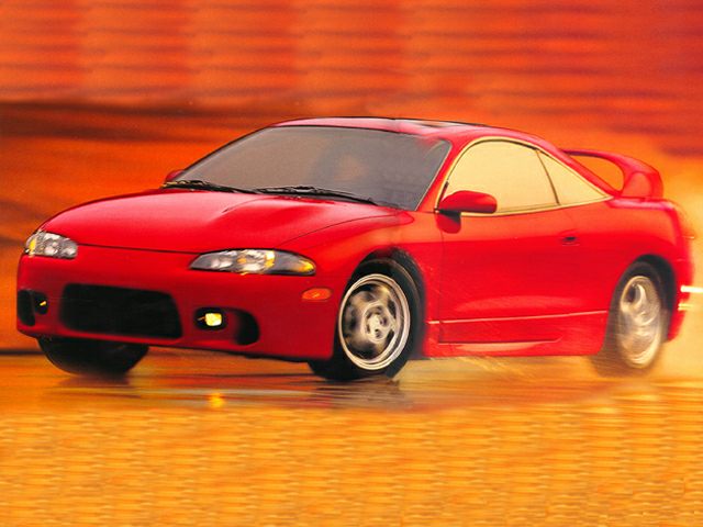 Red sports coupe with aerodynamic shape and front fog lights