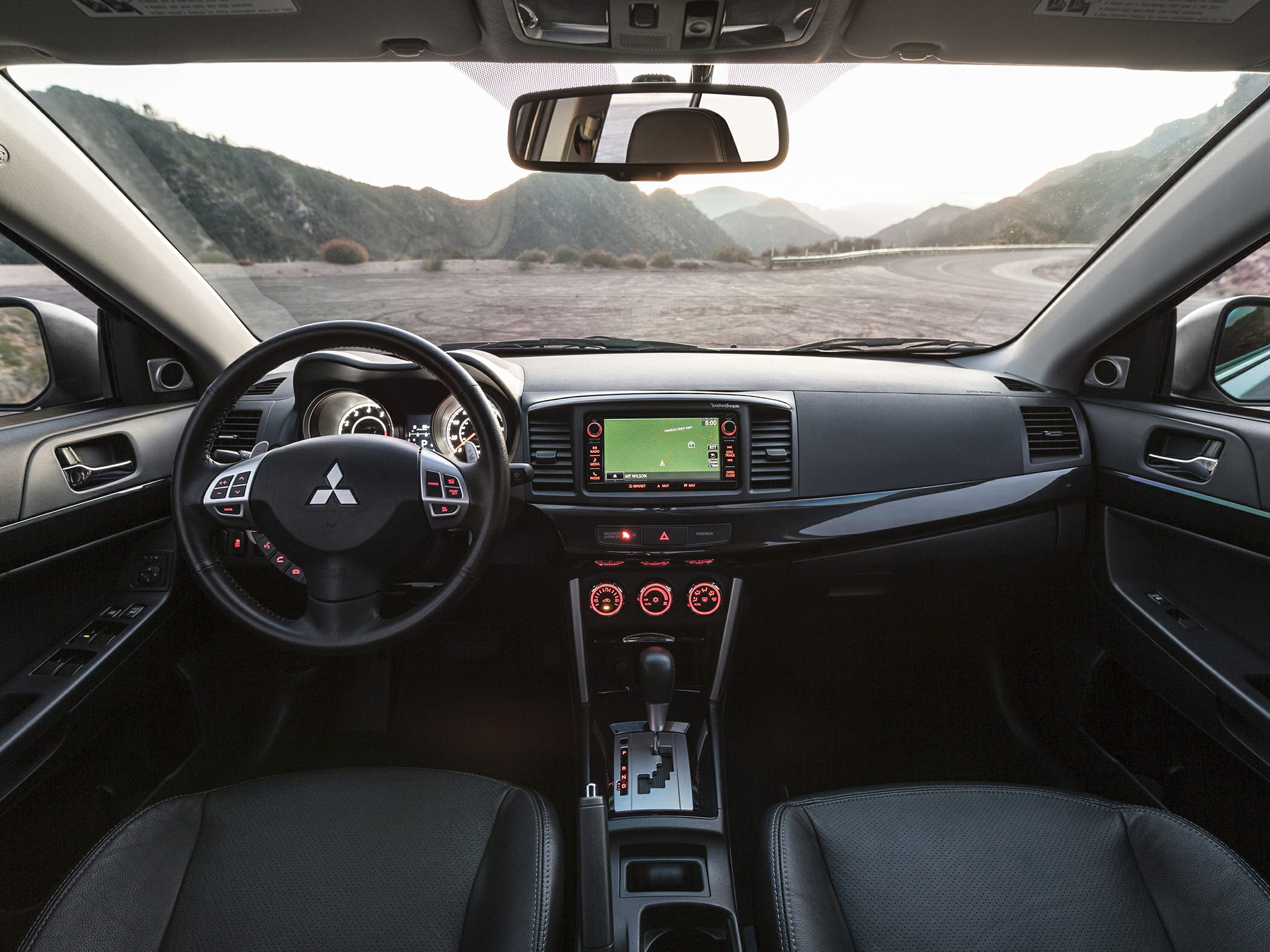 Dashboard and steering wheel with infotainment in car interior