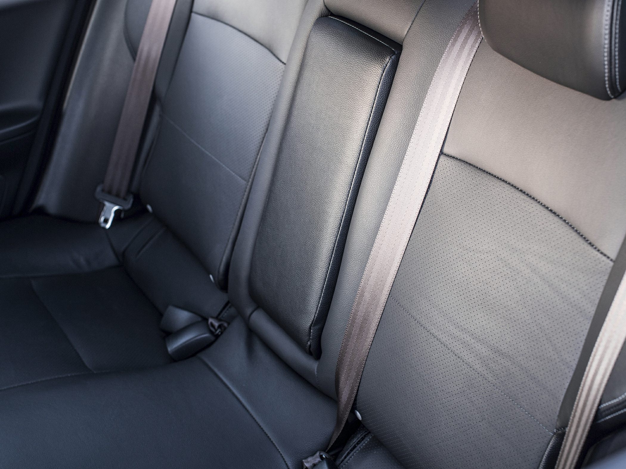 Close-up of rear leather seats and seat belts