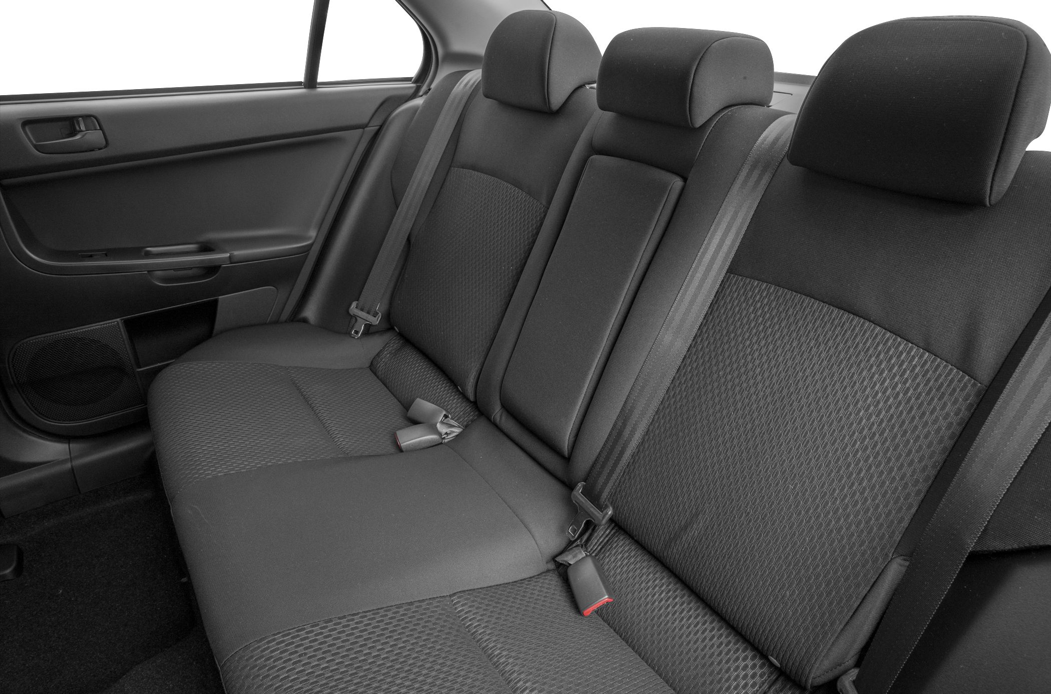 Rear fabric seats with seat belts and headrests inside a car