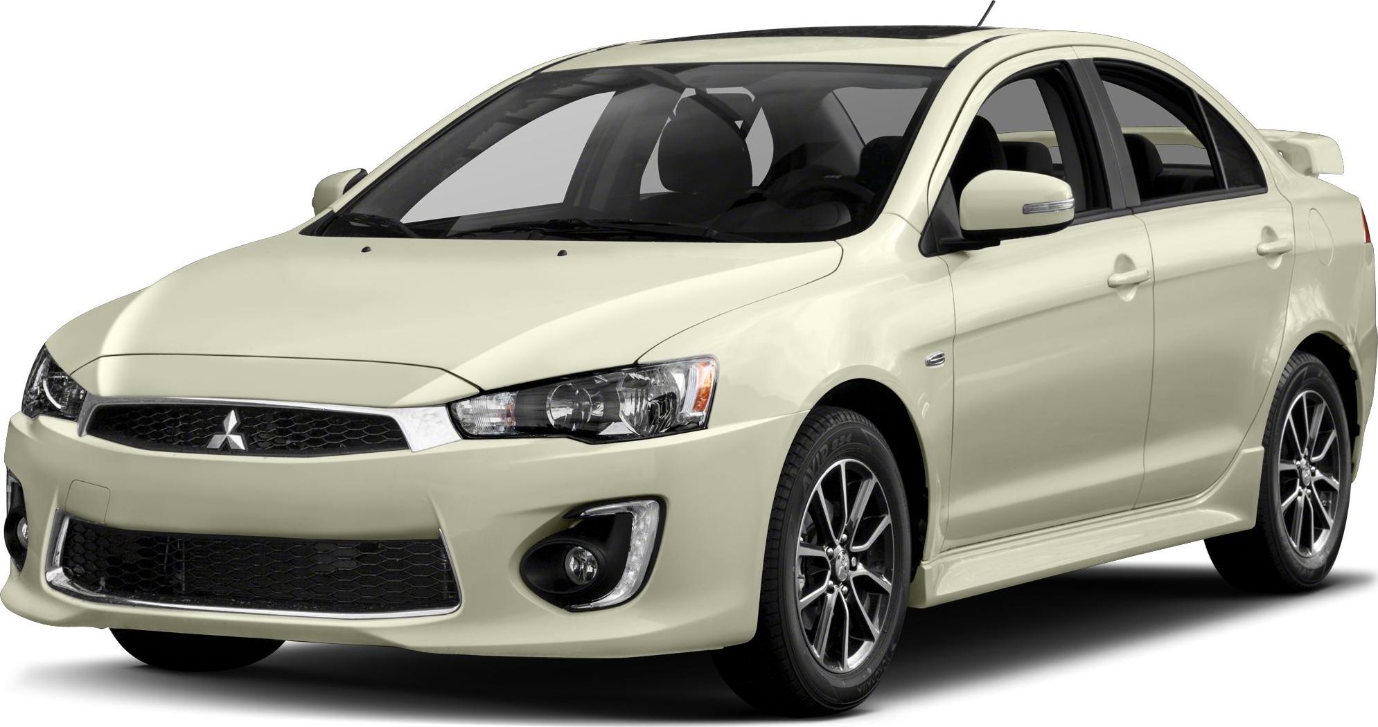 White sedan with sporty front grille and alloy wheels.