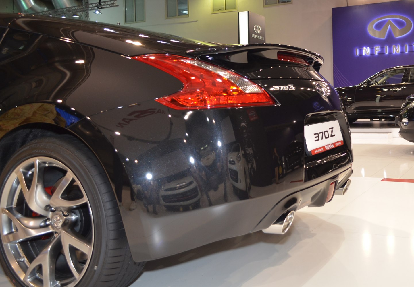 Rear view with alloy wheels and dual exhaust