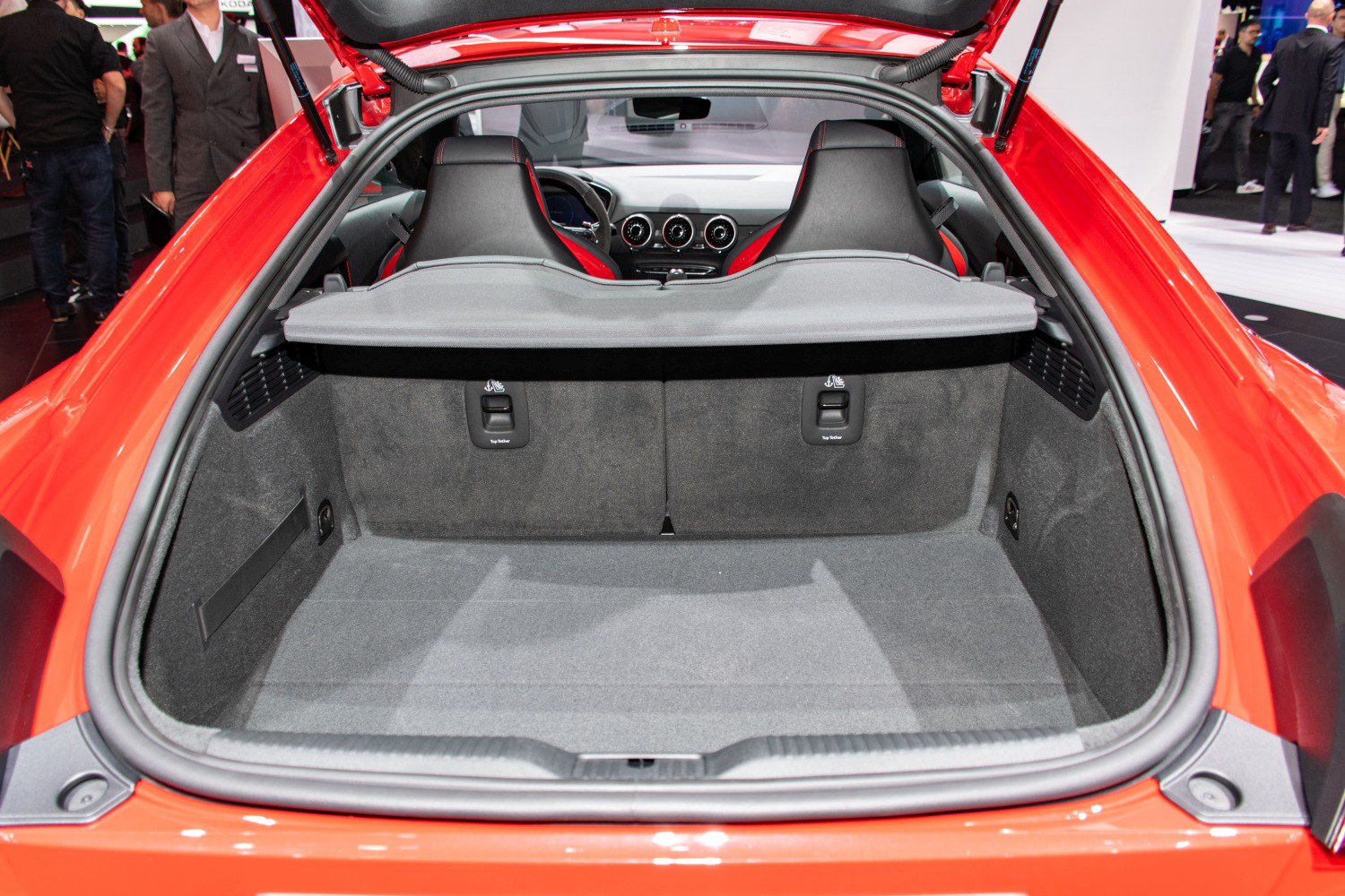 Spacious trunk with rear seats and dashboard visible