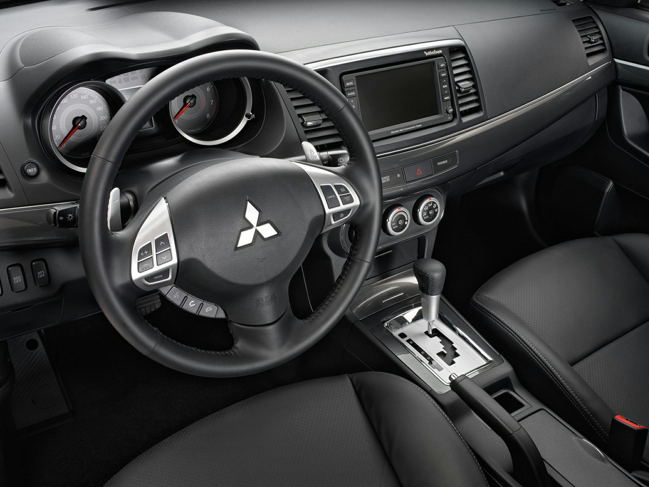 Steering wheel with controls and center console with automatic gear shifter