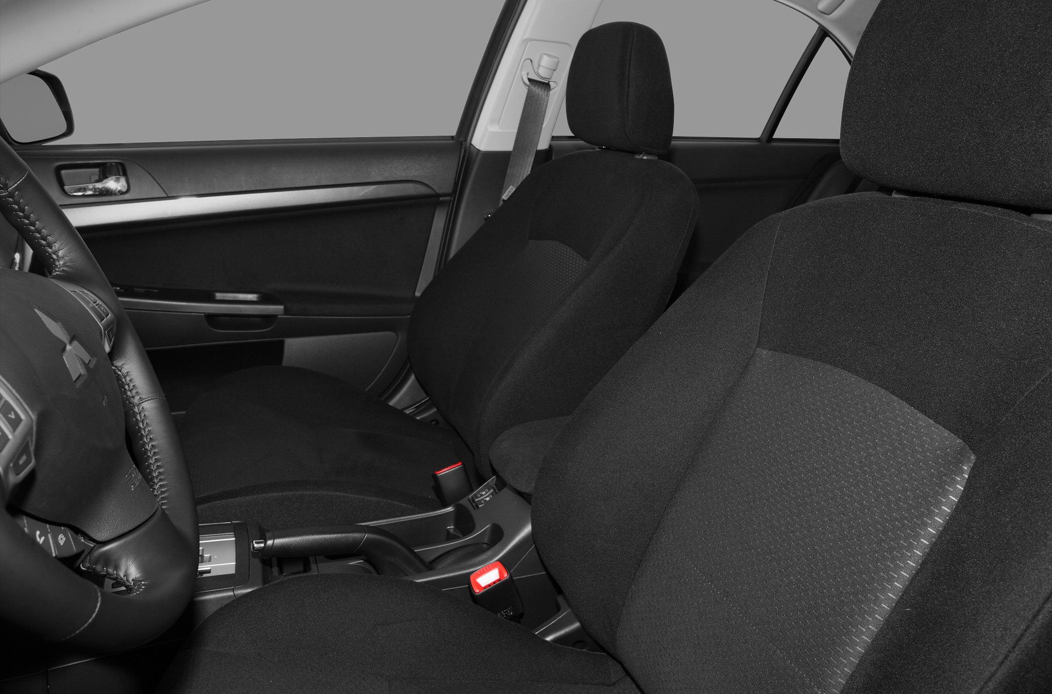 Front seats and dashboard interior with black fabric upholstery