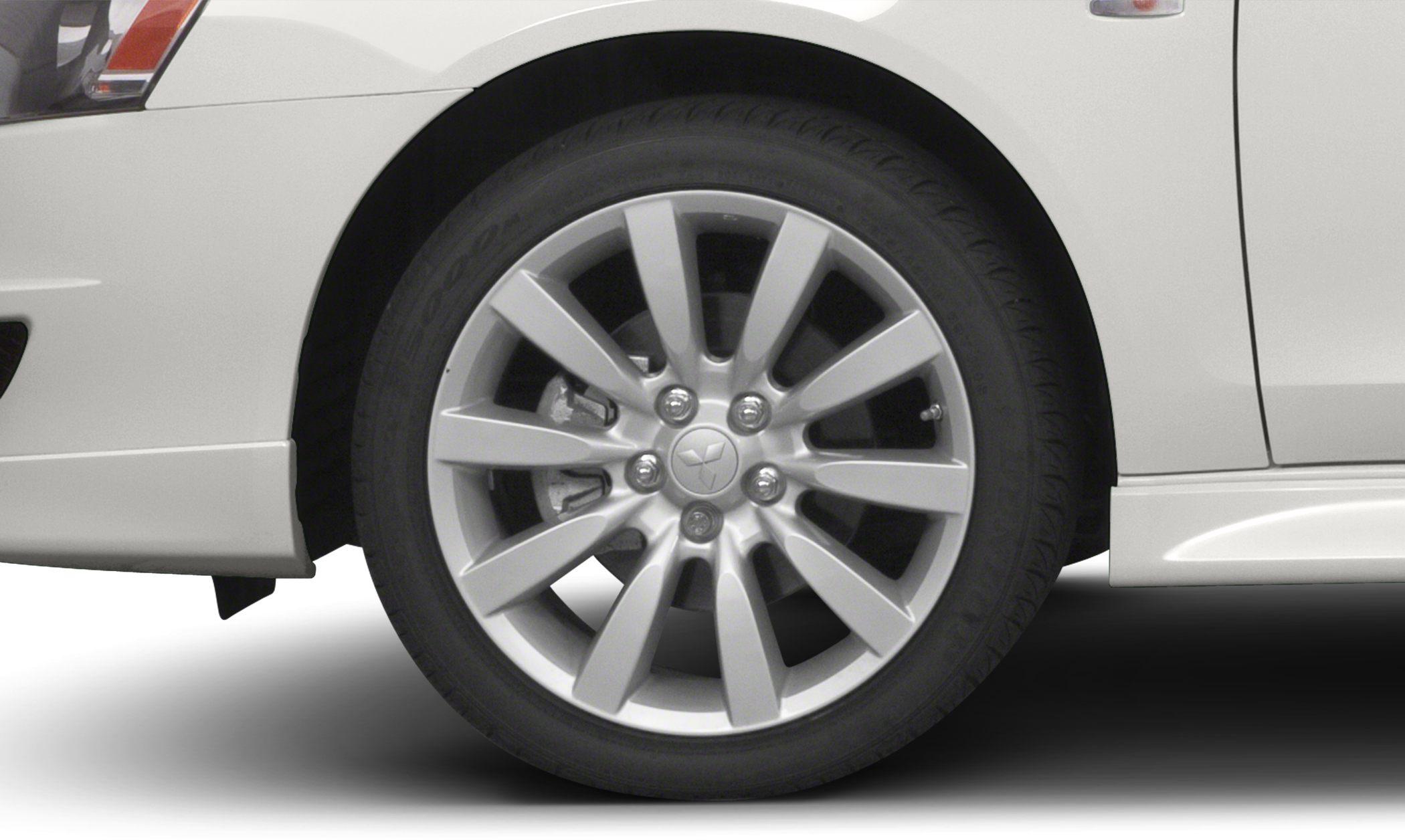 Close-up of a multi-spoke alloy wheel and disc brake assembly.