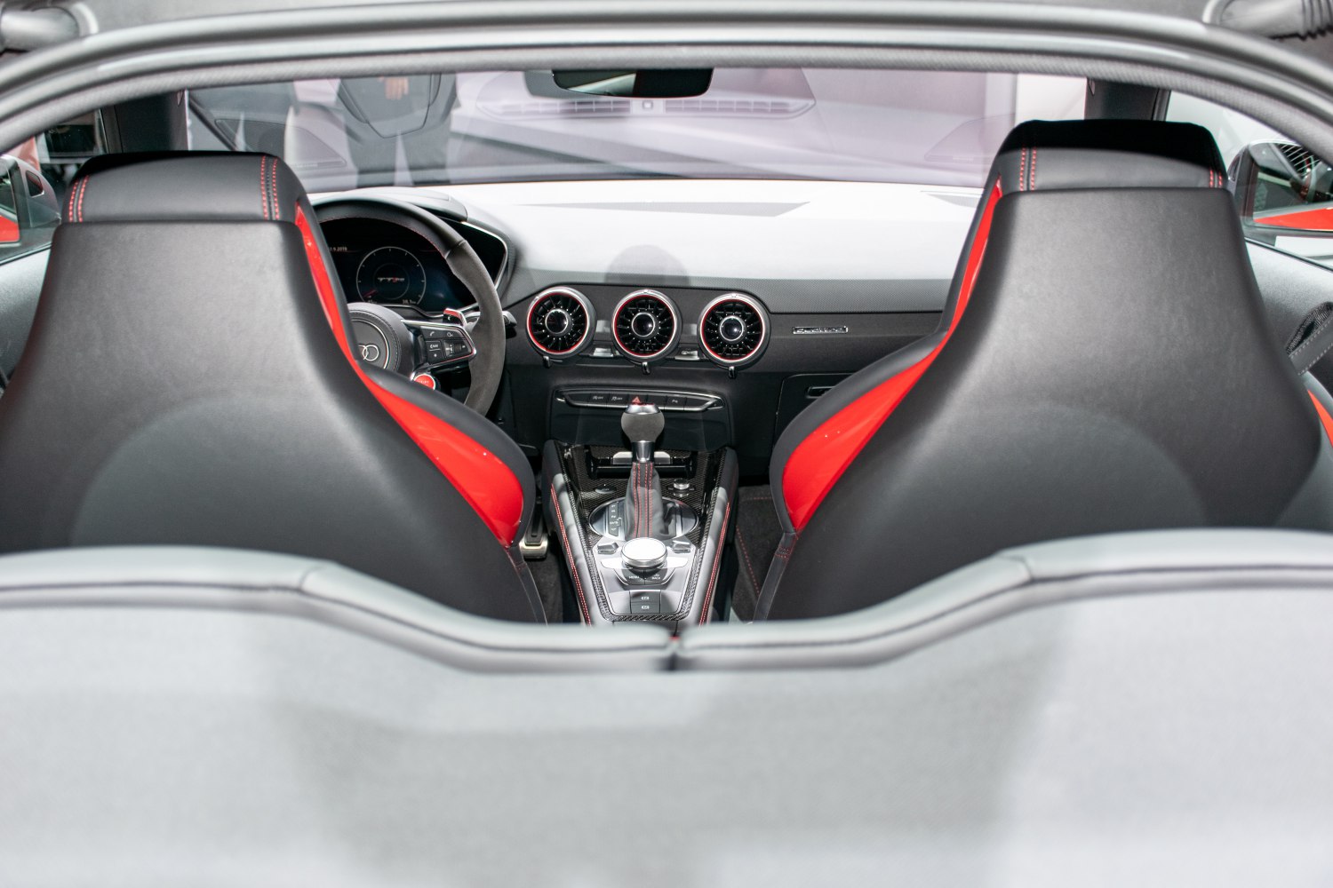 Sport seats and modern dashboard with central air vents and gear shift