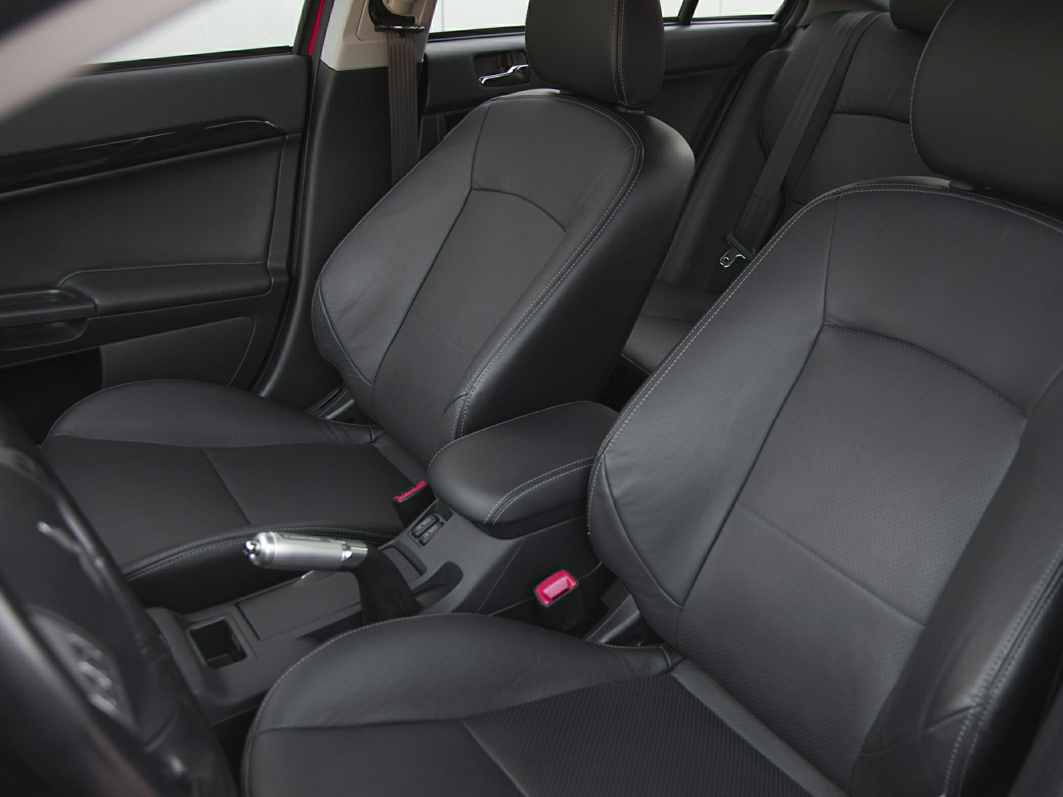 Black leather front seats and center console with handbrake lever
