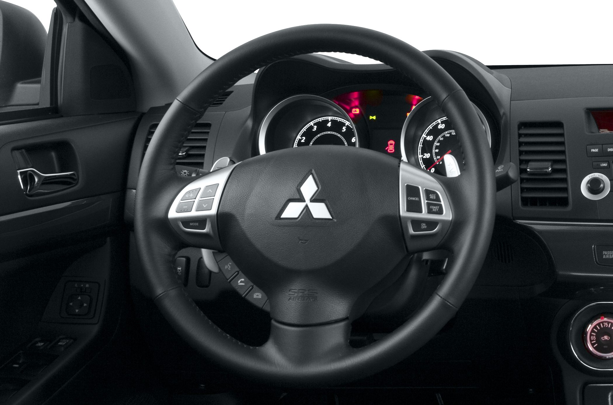 Steering wheel with control buttons and illuminated dashboard gauges.
